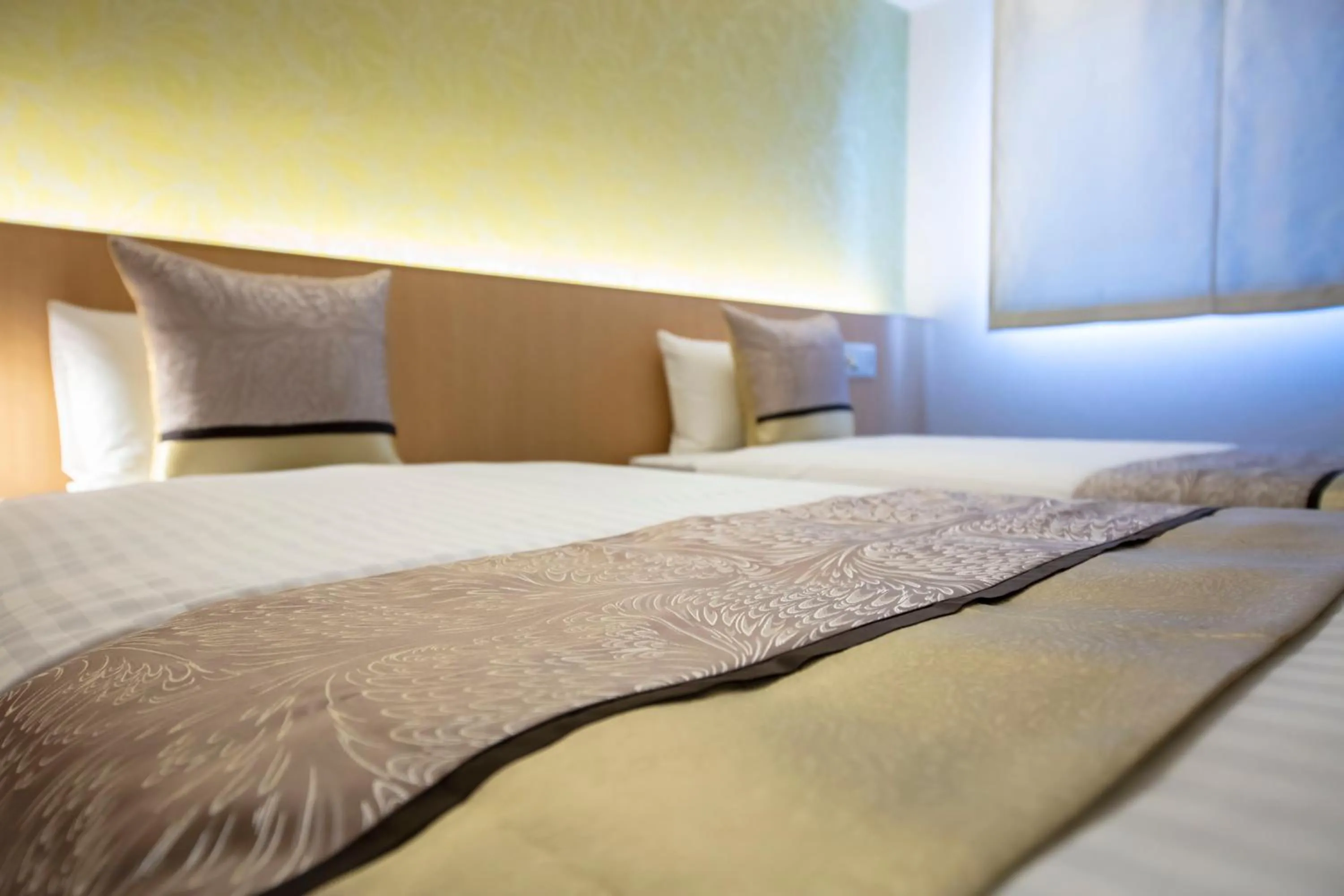 Bed in GRAND BASE Okayama Ekimae