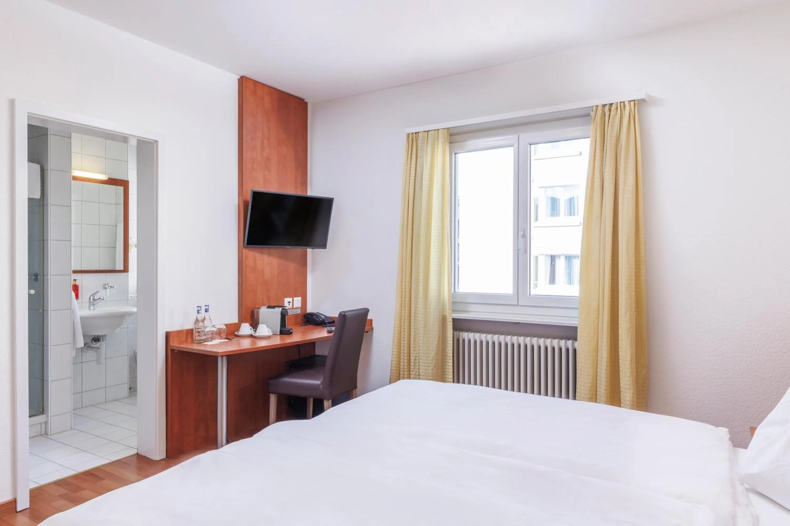 Photo of the whole room, Bed in Sorell Hotel Sonnental Dübendorf