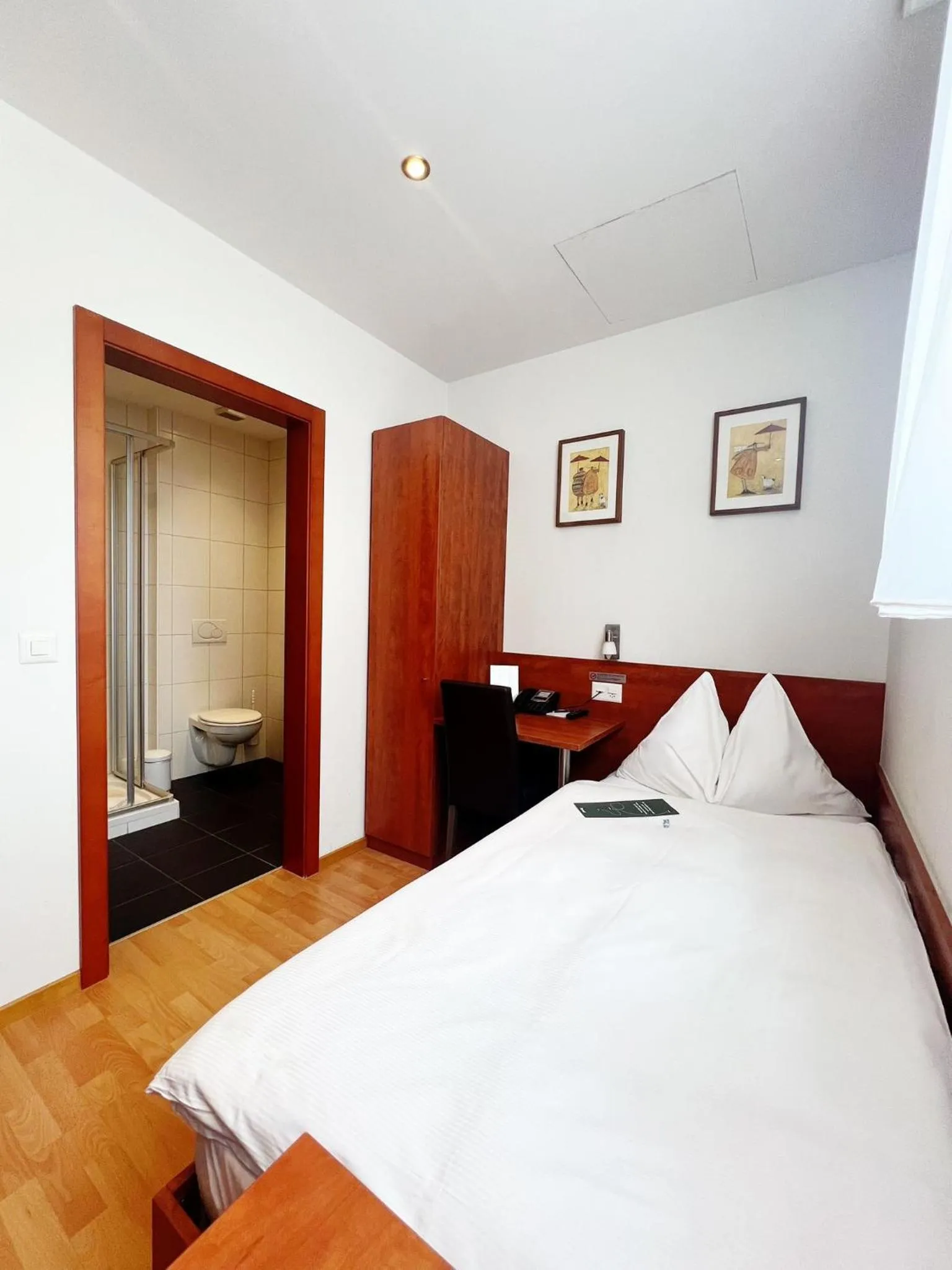 Bathroom, Bed in Sorell Hotel Sonnental Dübendorf