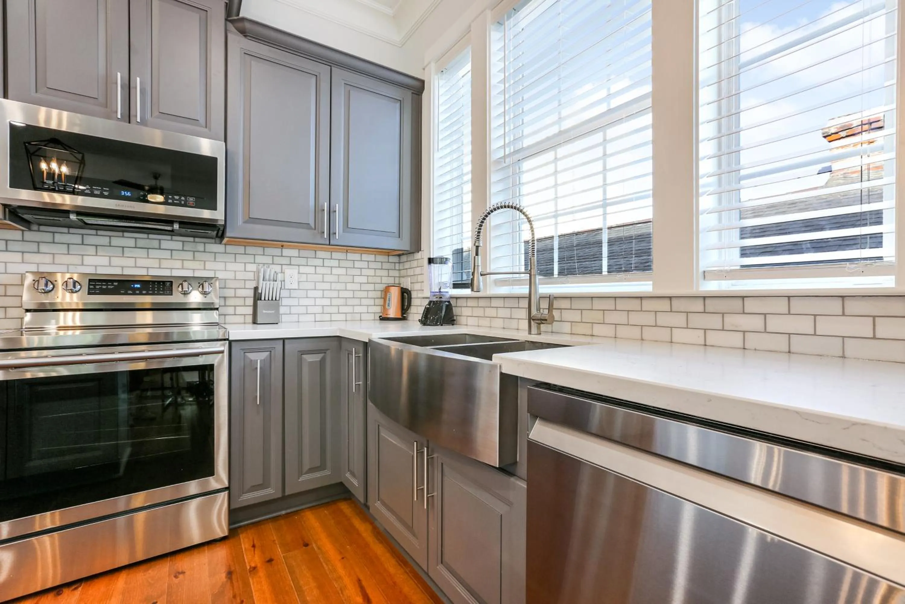 Kitchen or kitchenette in Hosteeva Chic Urban Retreat w Pool Steps to St Charles Ave and Near Bourbon St