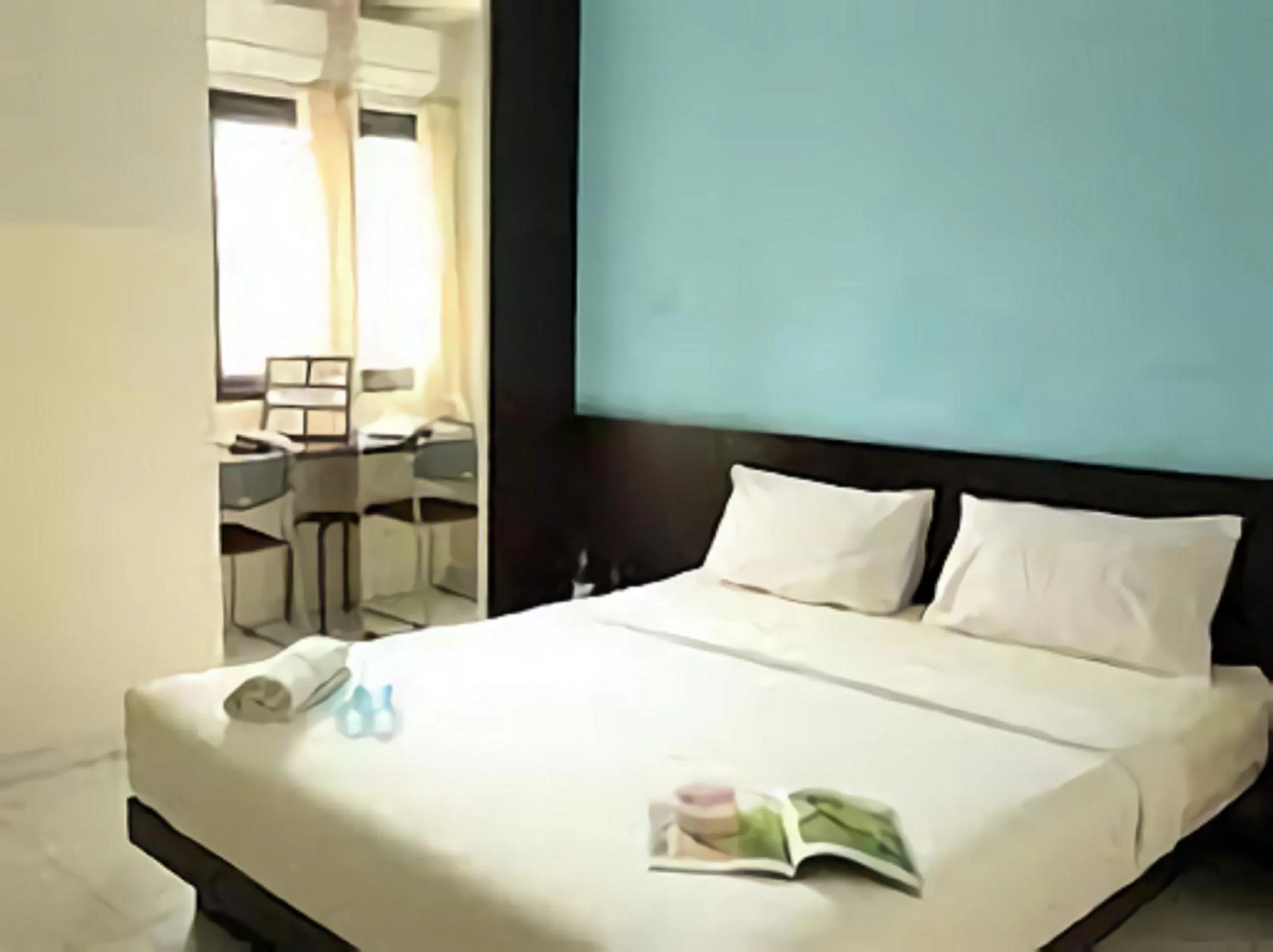 Bed in LeGreen Suite Ratulangi