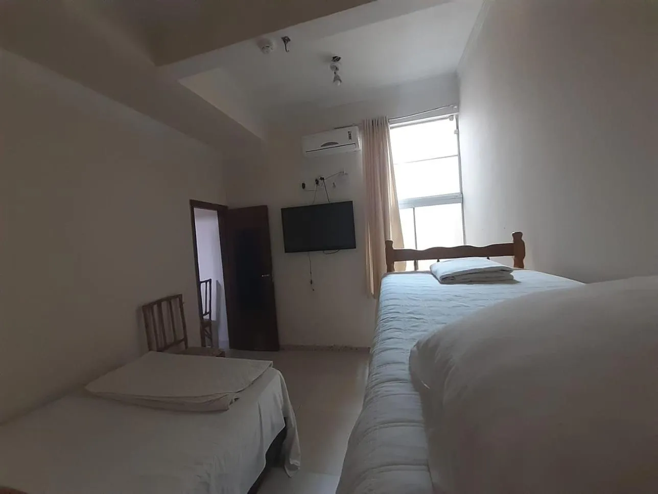 Bed in Pousada Maré Boa