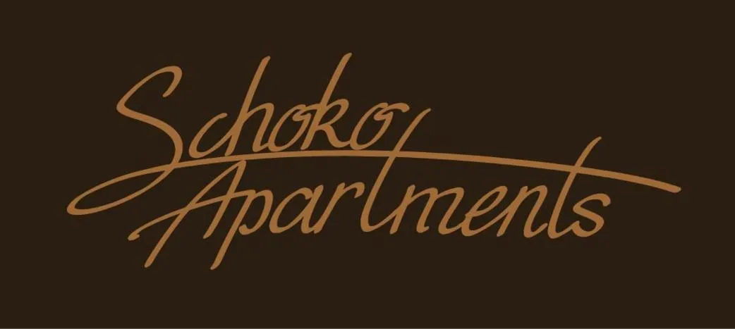 Property logo or sign in Schoko-Apartments mit Bad & Küche