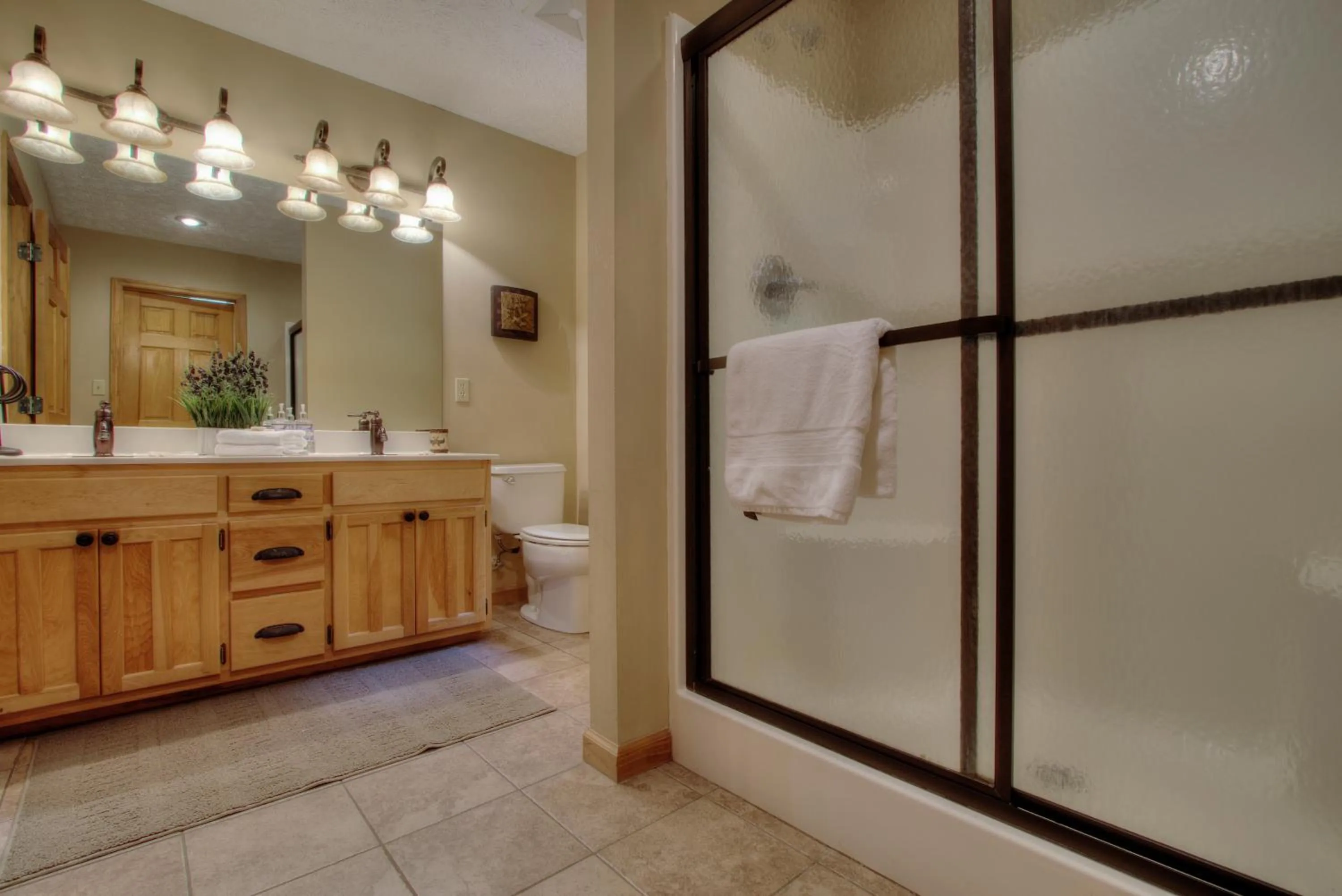 Bathroom in Gorgeous "Country Roads" by HoneyBearCabins 4BR 4BA, next to pool, easy drive, main strip location!