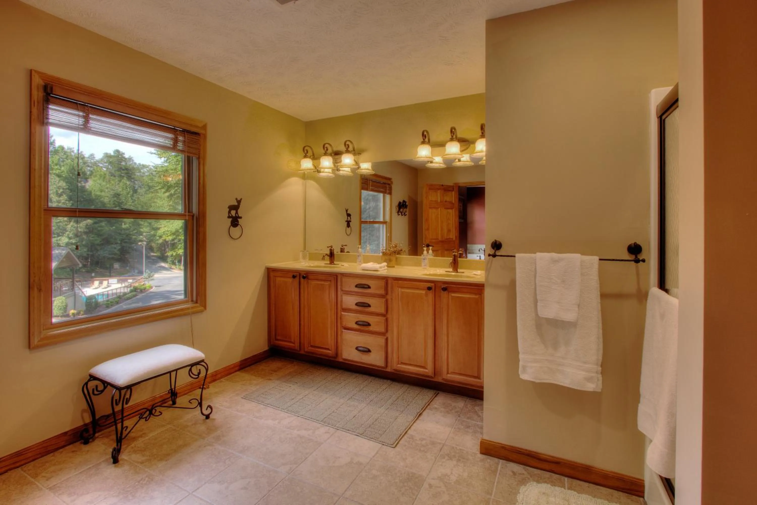 Bathroom in Gorgeous "Country Roads" by HoneyBearCabins 4BR 4BA, next to pool, easy drive, main strip location!