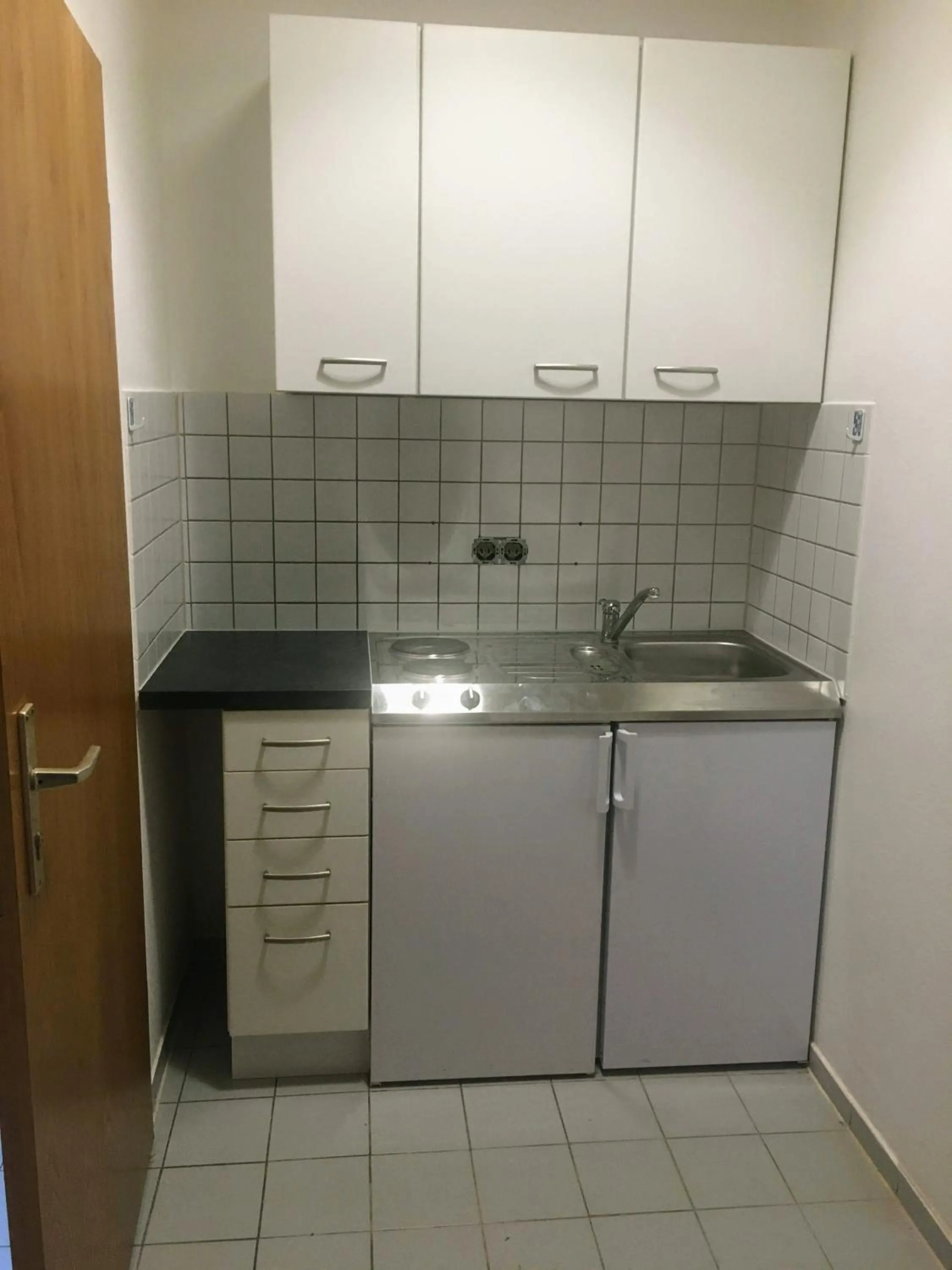 Kitchen or kitchenette in Airport Park Hotel MUC