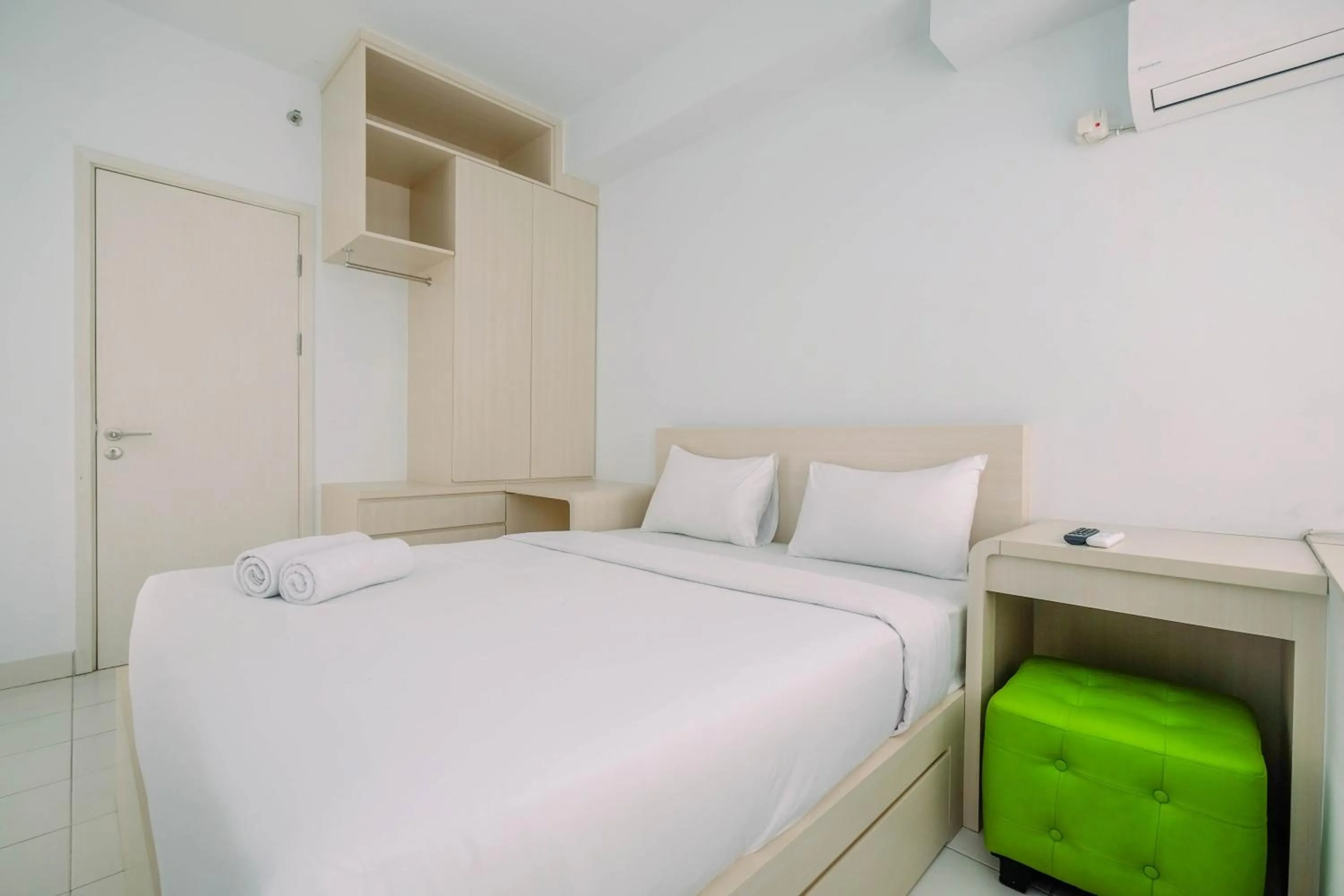 Bed in Comfy and Minimalist 1BR Patraland Urbano Apartment near Bekasi Station By Travelio