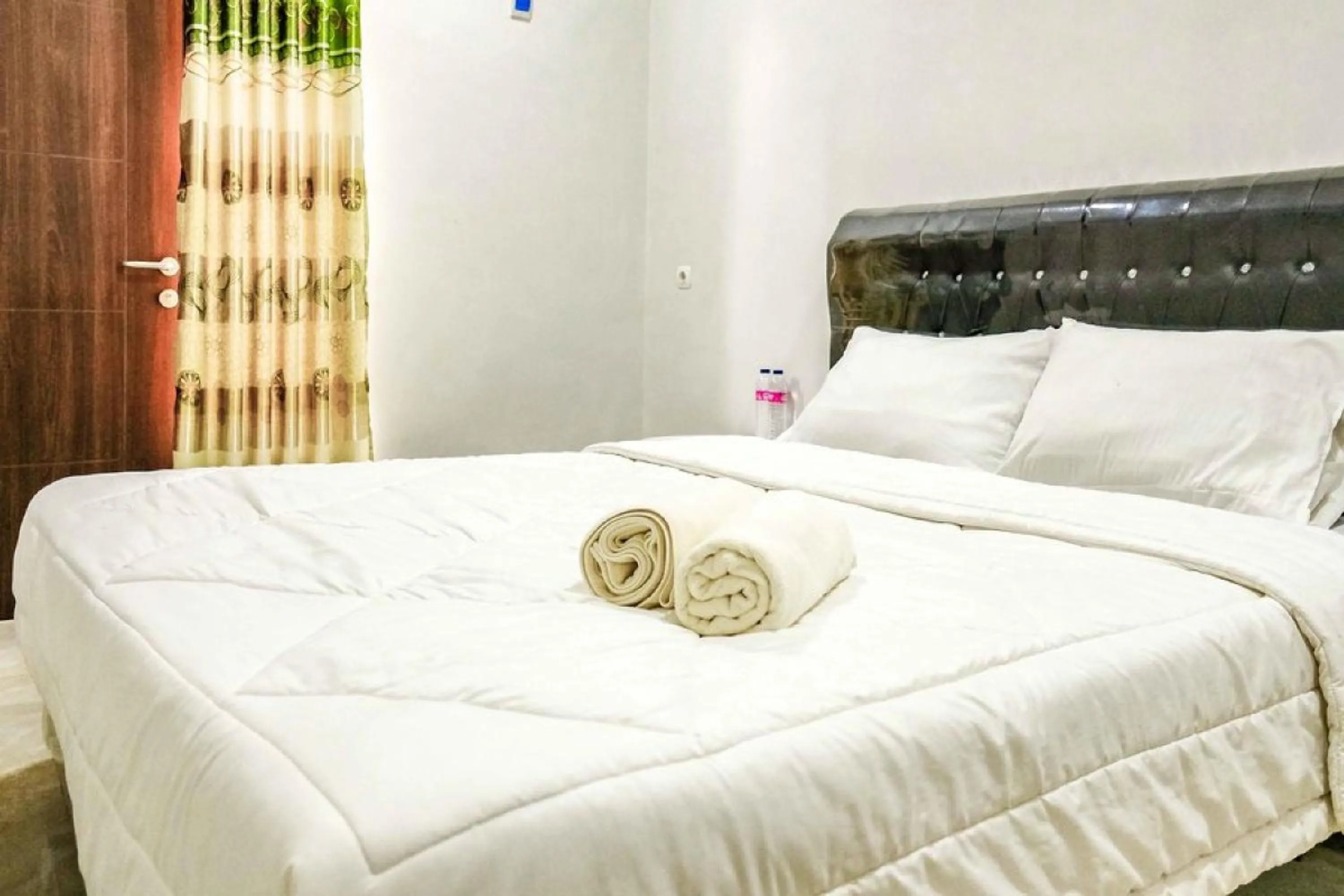 Bed in Rudi Rooms near Stasiun Cikarang Mitra RedDoorz