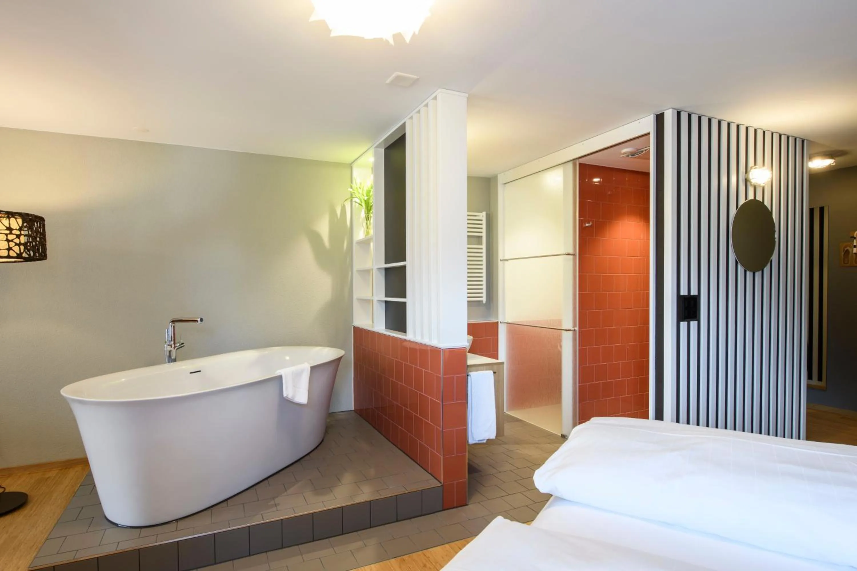 Bathroom, Bed in Seehotel Wilerbad Spa & Seminar