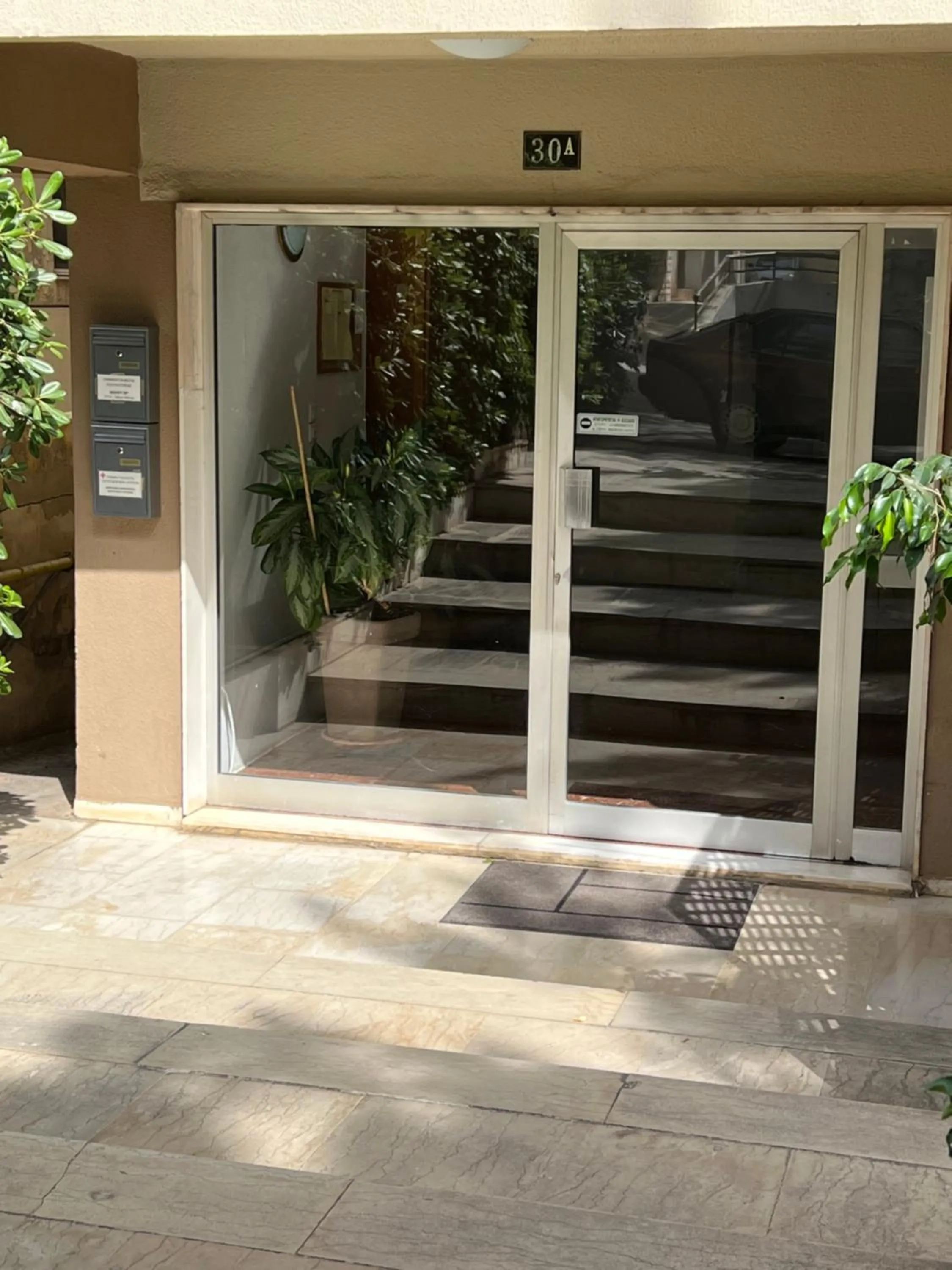 Facade/entrance in Peaceful Apartment by Flisvos Marina by Athenian Homes