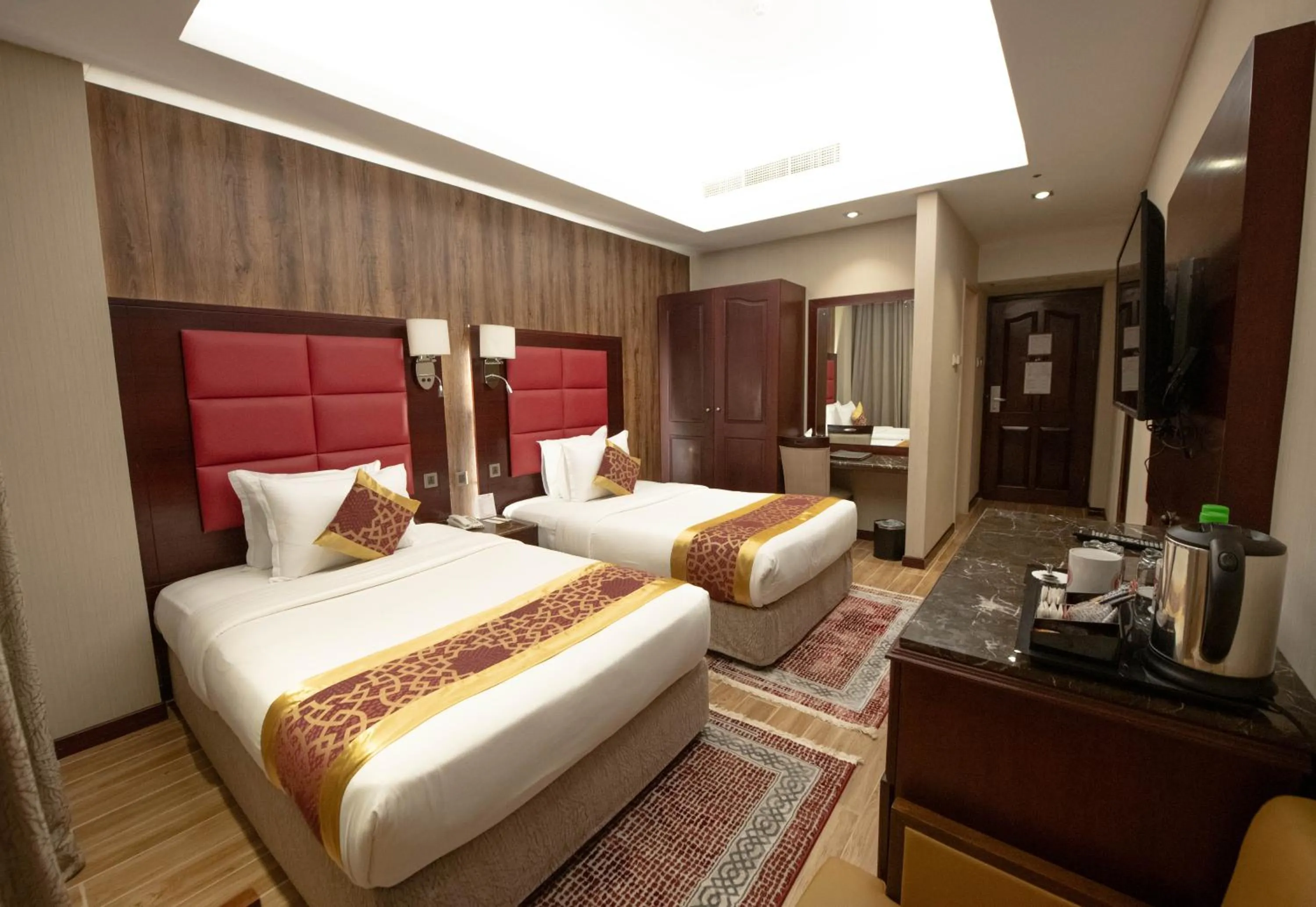 Bed in Ramee Guestline Hotel