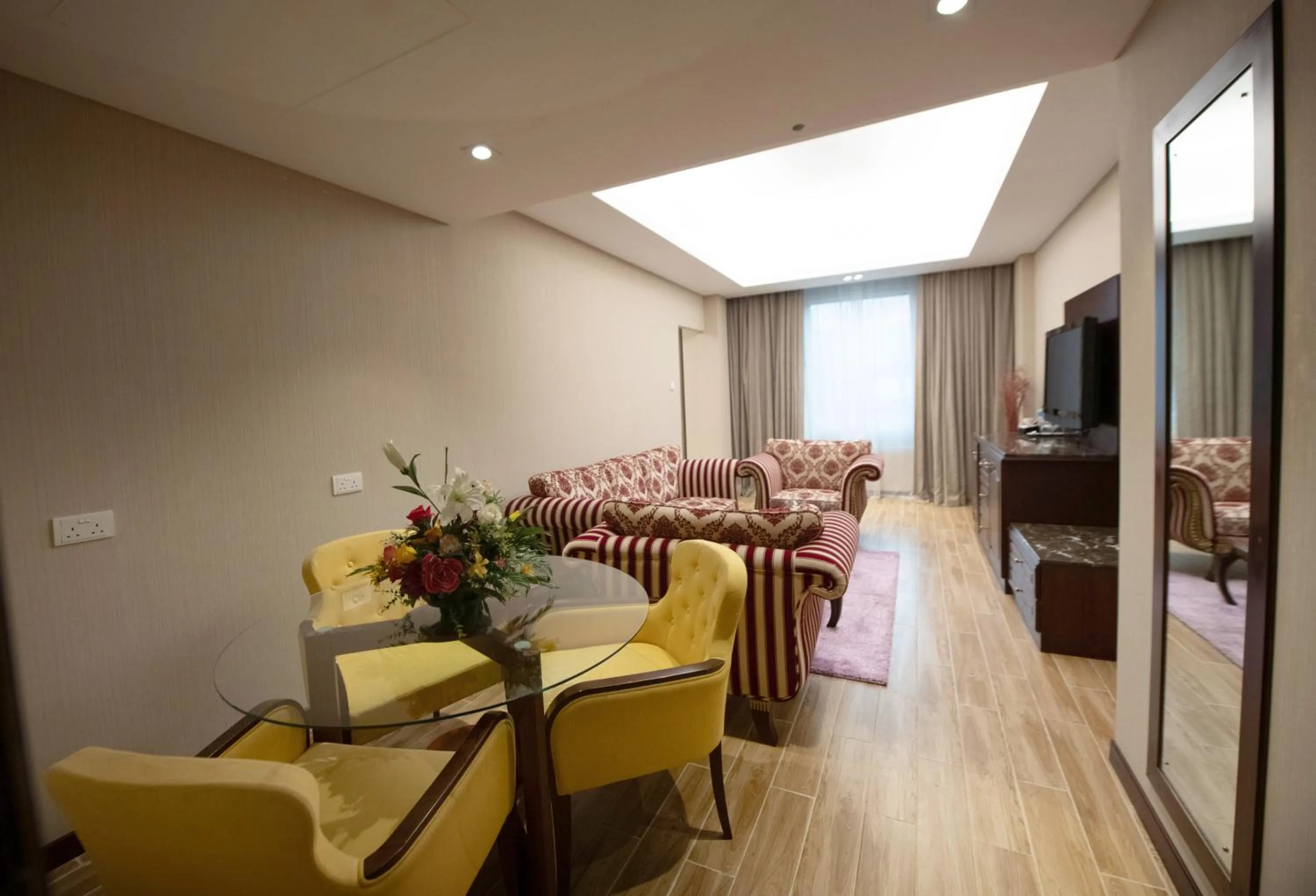 Living room in Ramee Guestline Hotel