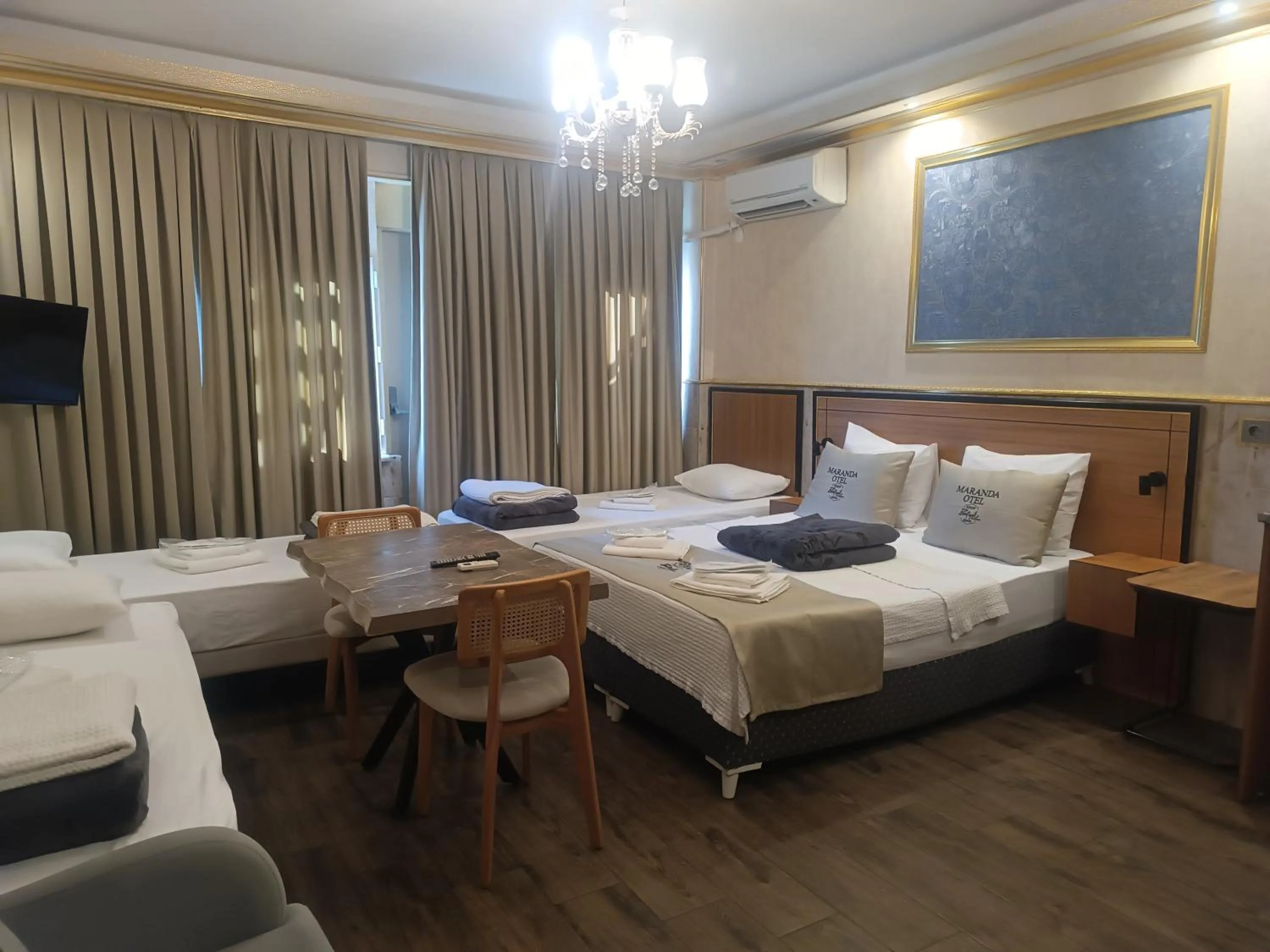 Living room, Bed in Maranda Suit Hotel