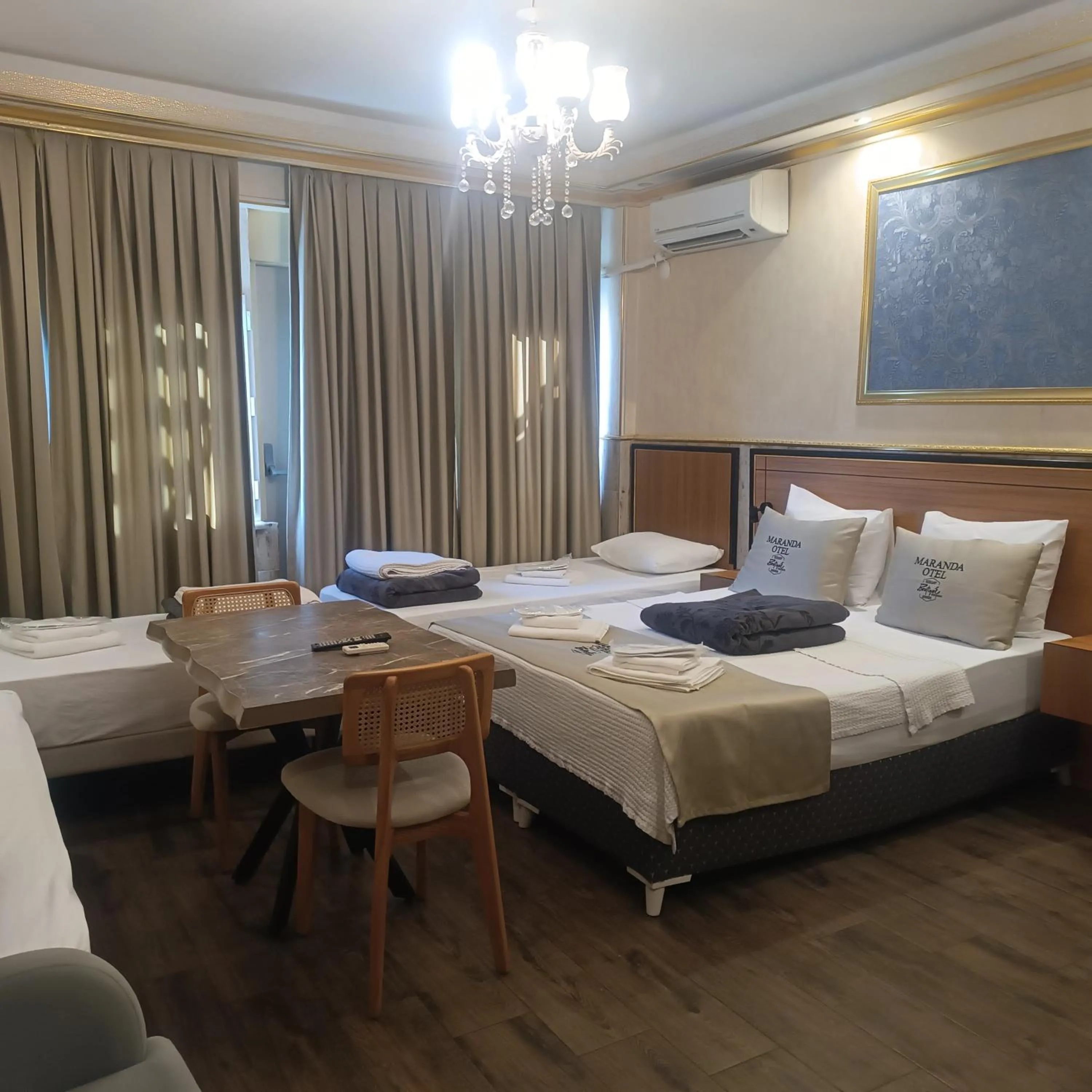 Living room, Bed in Maranda Suit Hotel