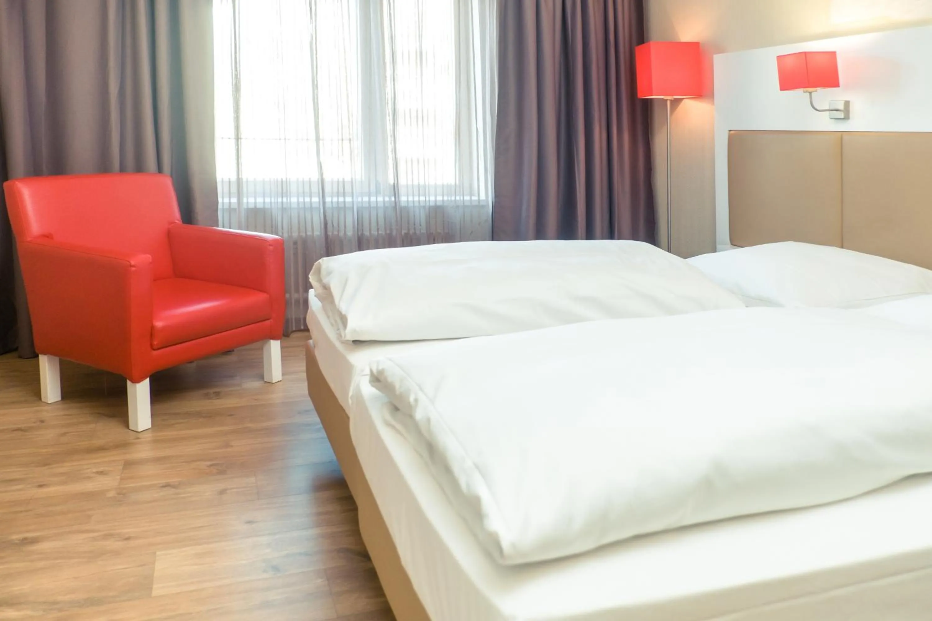 Photo of the whole room, Bed in Hotel Stuttgart Sindelfingen City by Tulip Inn