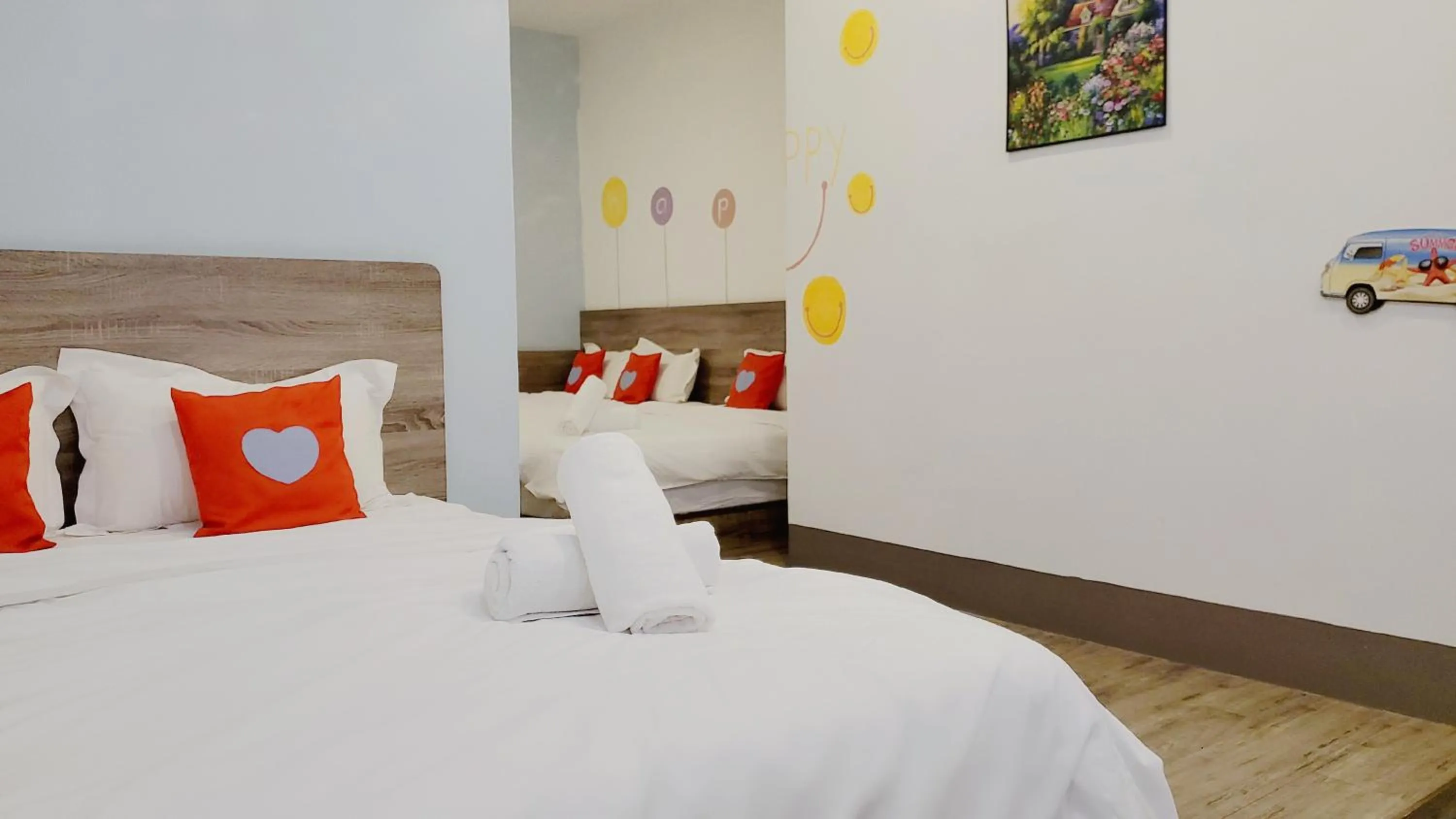 Bed in Winggarden Murals House by JE Boutique Guesthouse