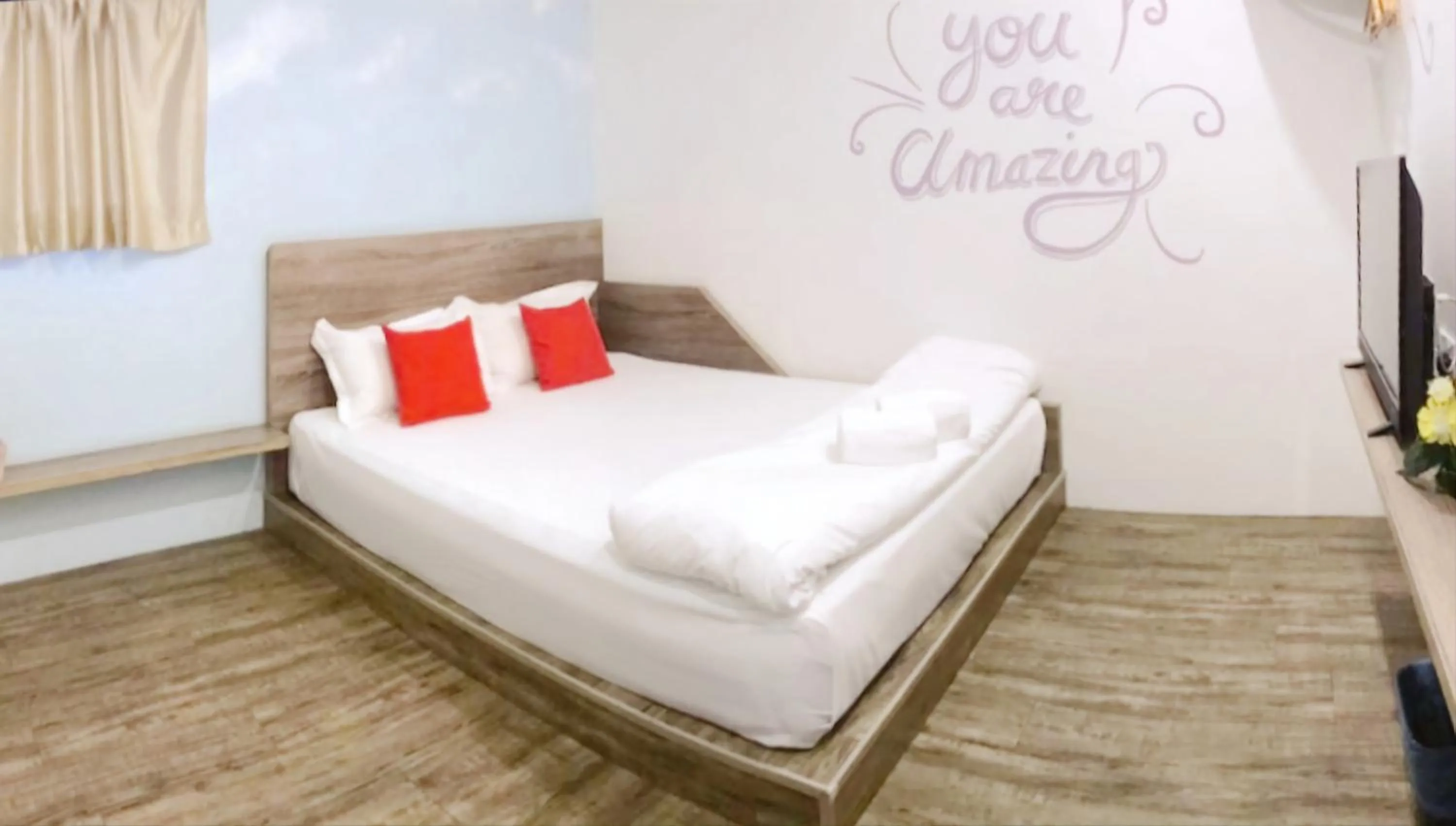 Bed in Winggarden Murals House by JE Boutique Guesthouse