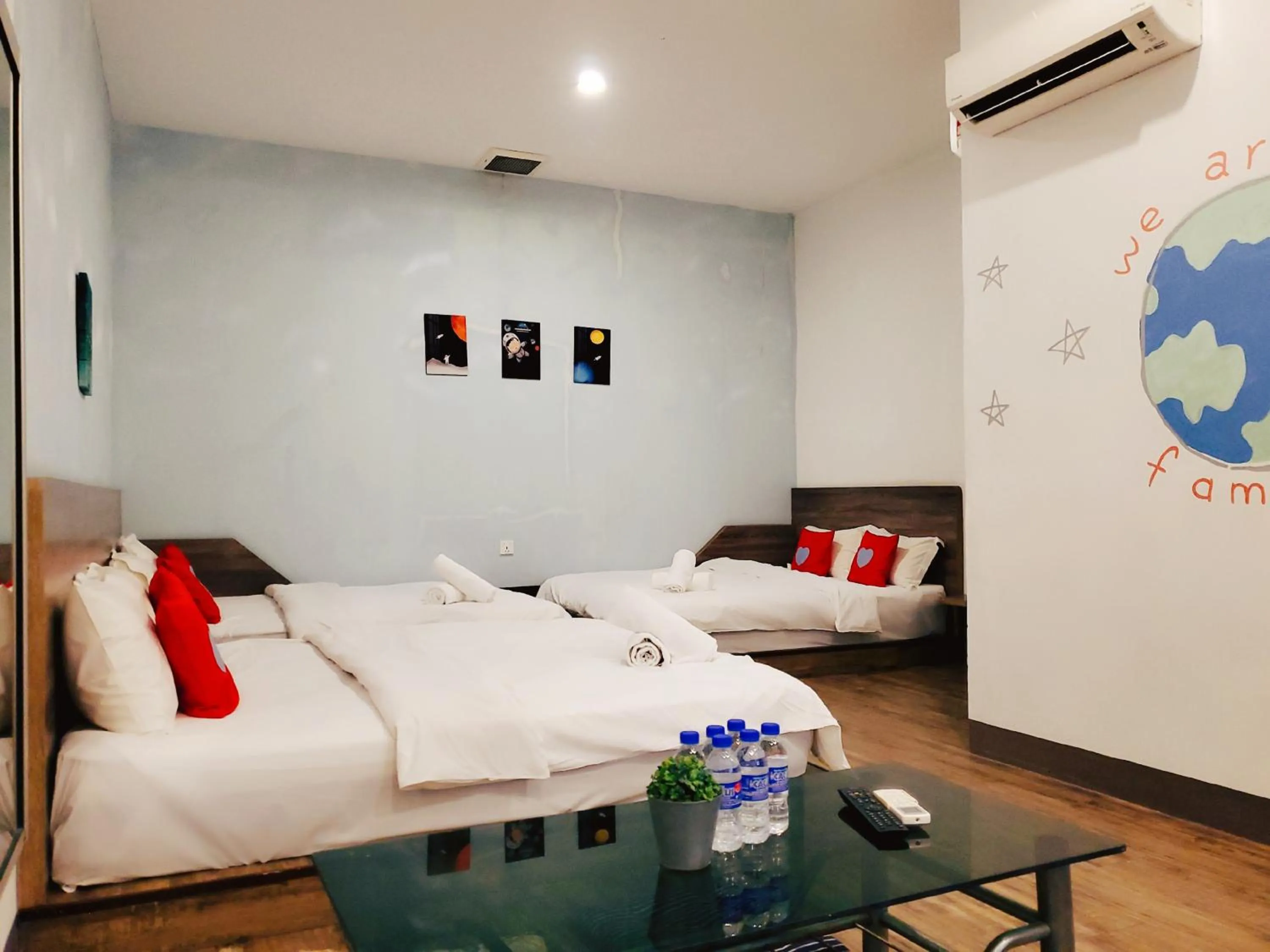 Bed in Winggarden Murals House by JE Boutique Guesthouse