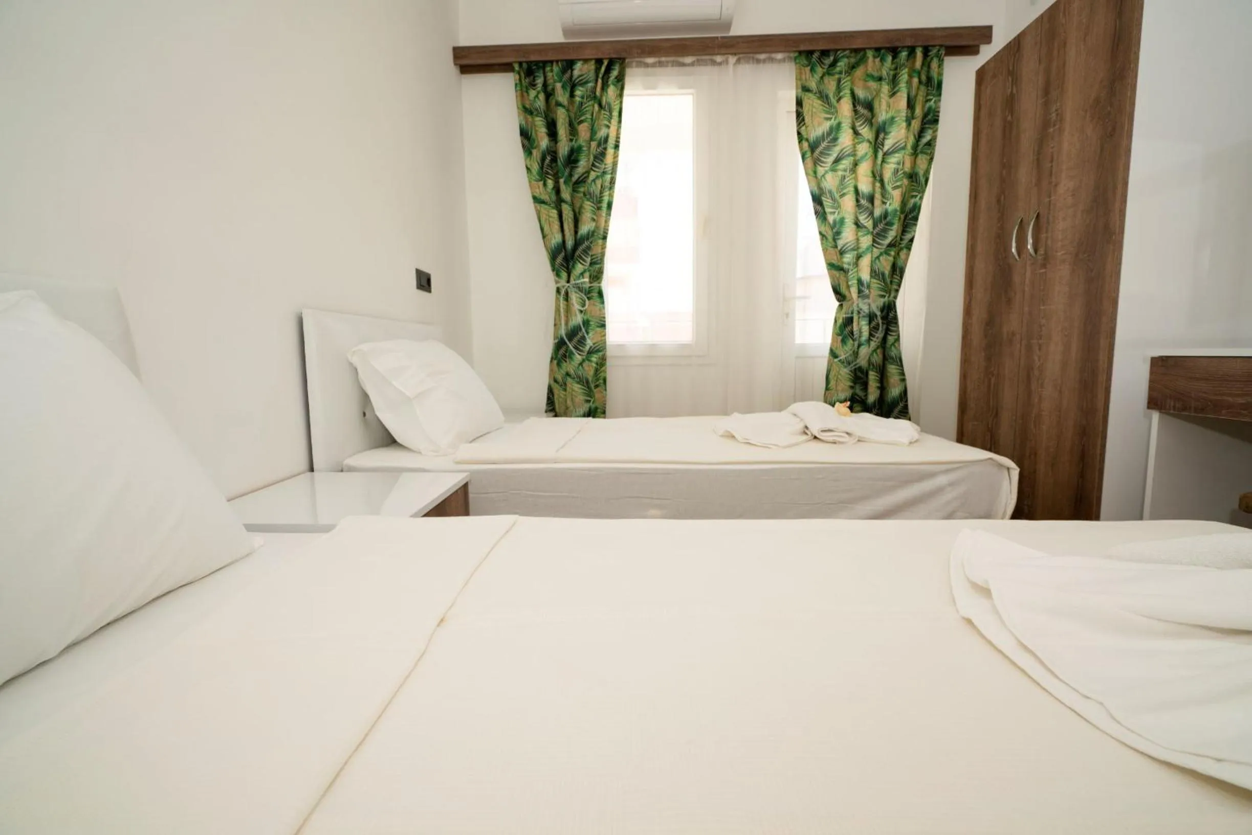 Bed in ESQUIRE HOTELS and LOUNGES