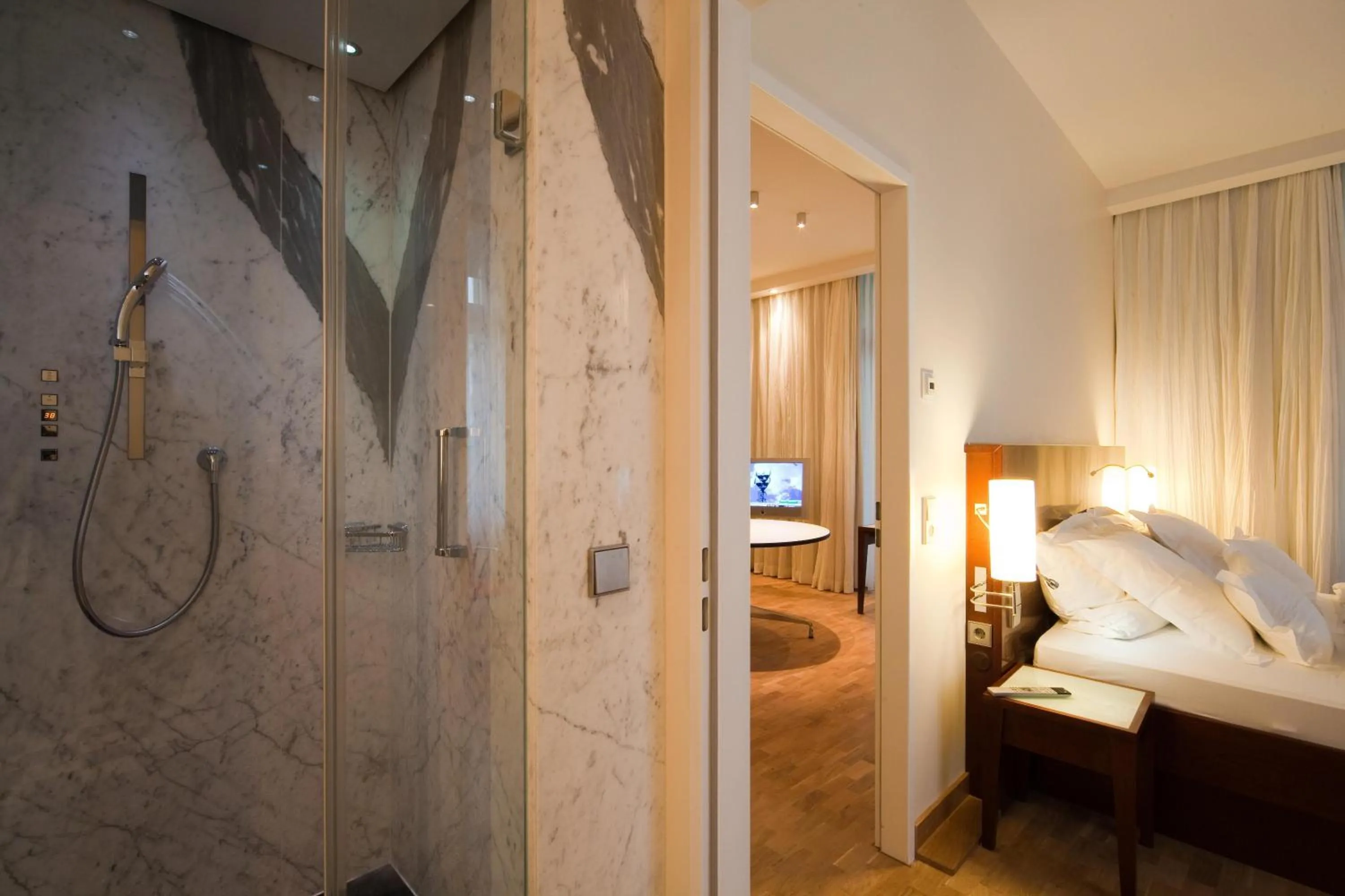 Bathroom, Bed in Grand Hotel Mussmann