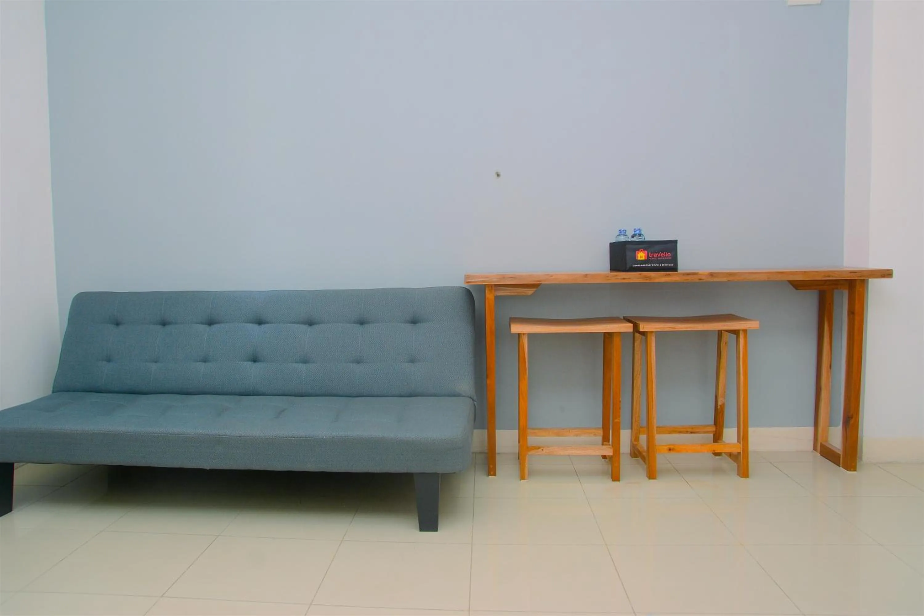 Living room in Best Deal 3BR Apartment Bassura City near Shopping Center By Travelio