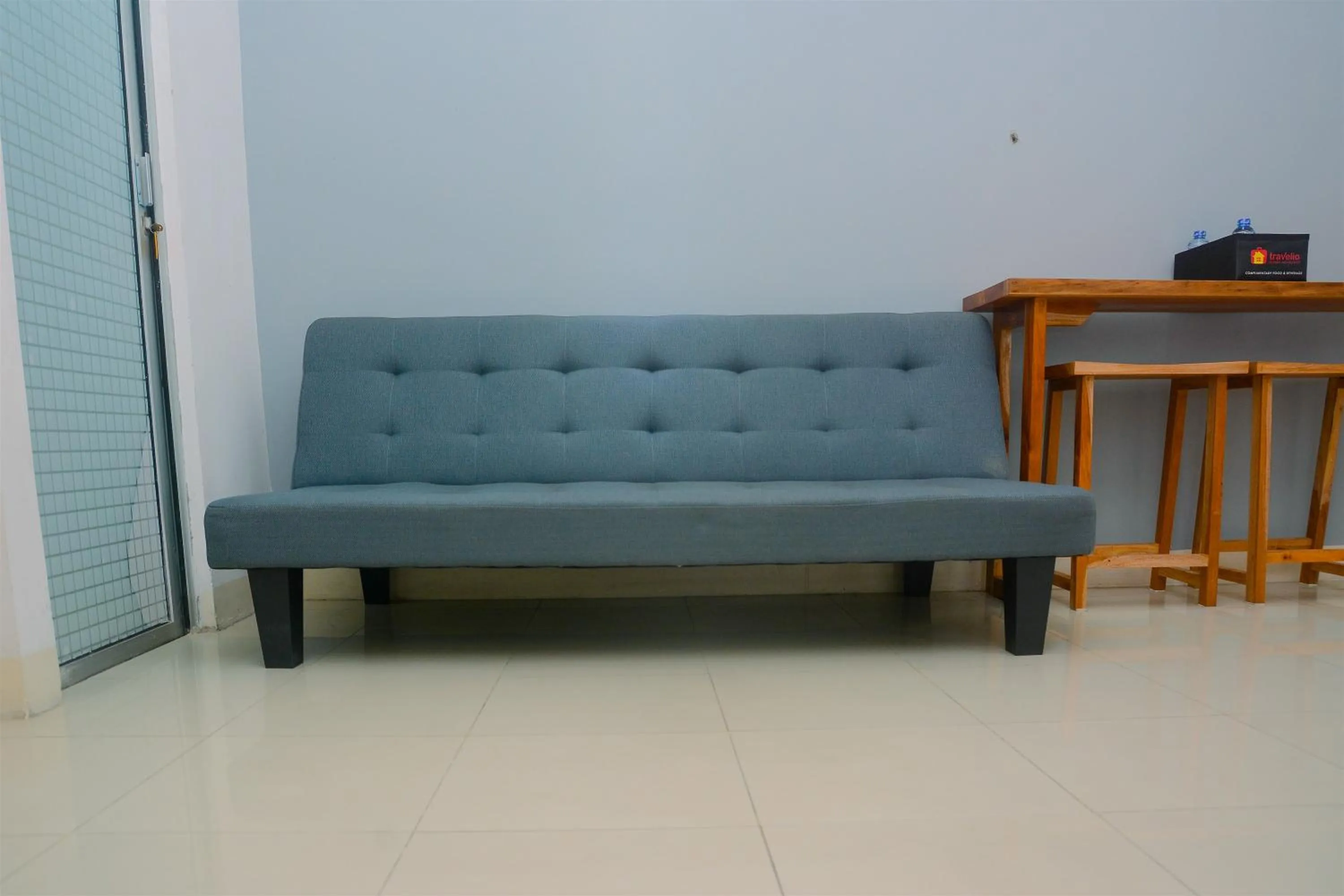 Living room in Best Deal 3BR Apartment Bassura City near Shopping Center By Travelio