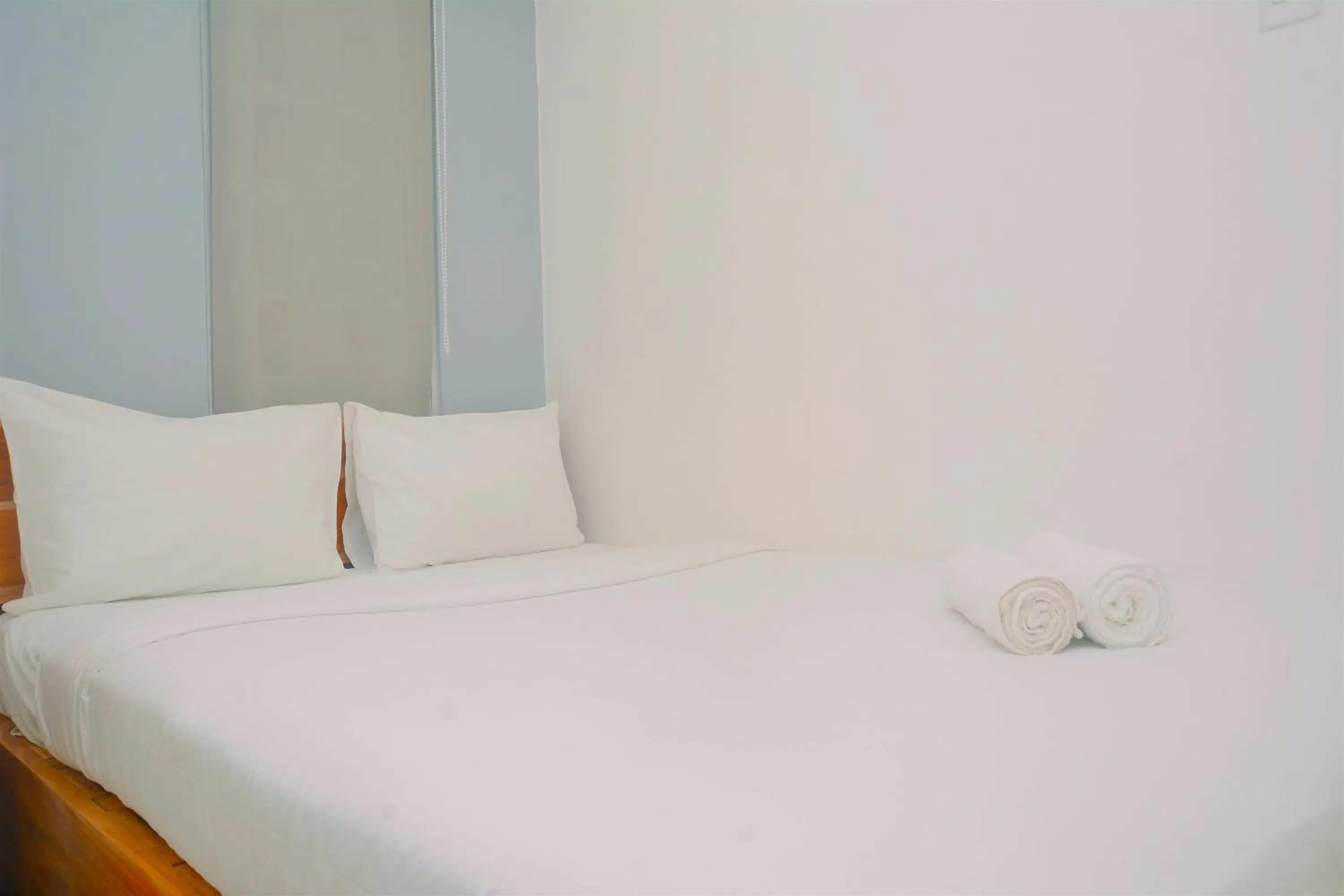 Bed in Best Deal 3BR Apartment Bassura City near Shopping Center By Travelio