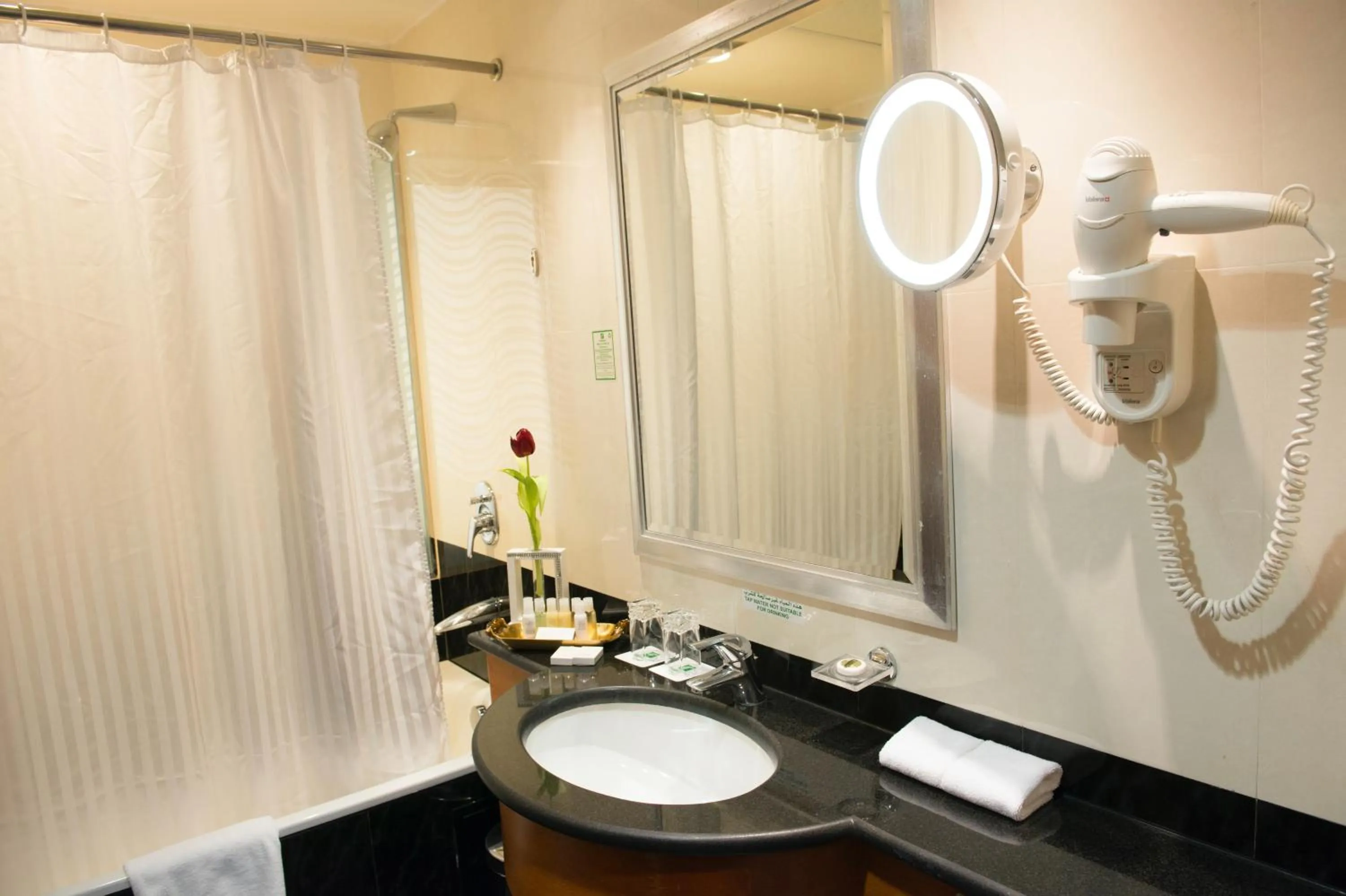 Bathroom in Holiday Inn - Suites Kuwait Salmiya by IHG