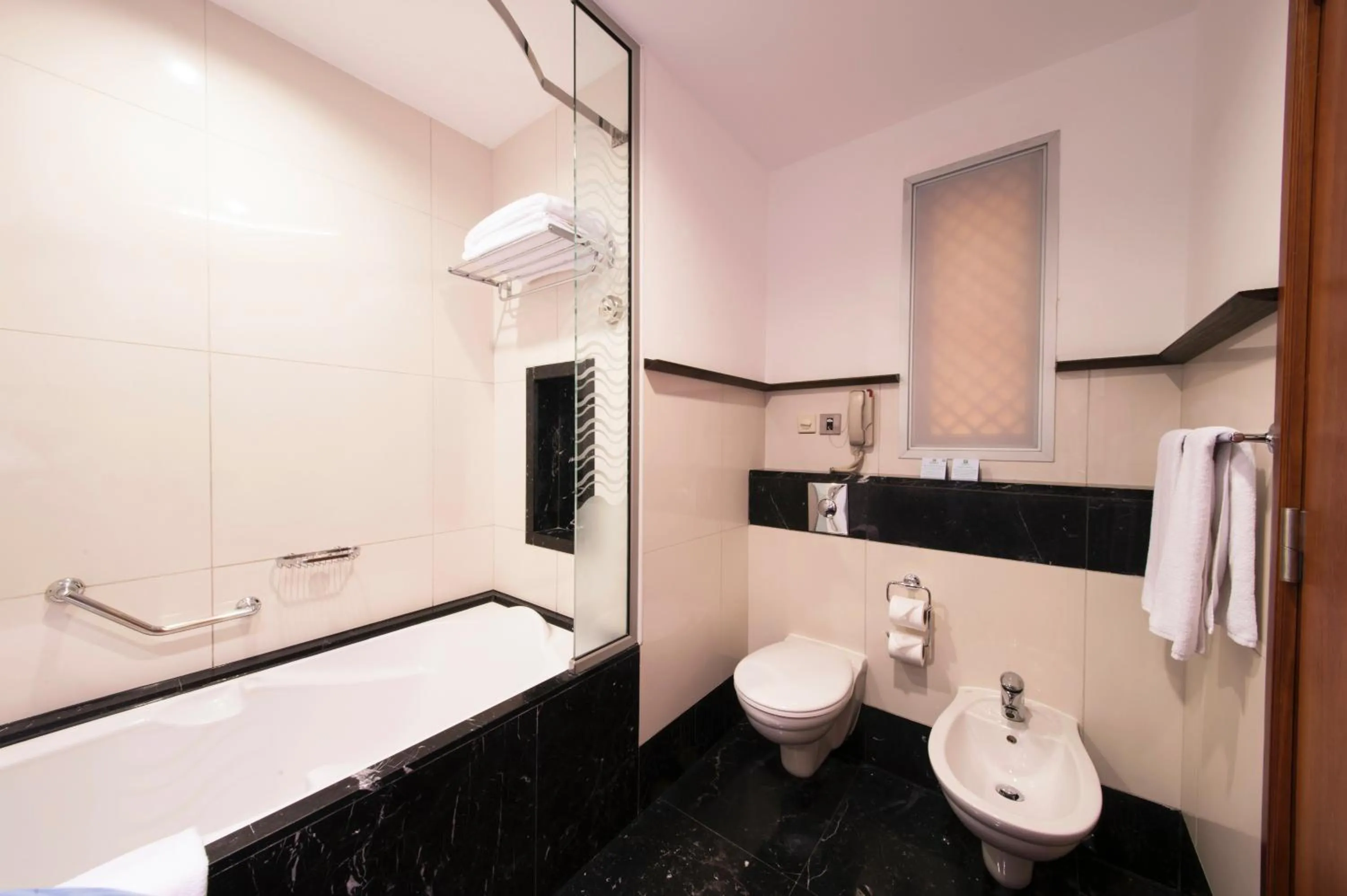 Bathroom in Holiday Inn - Suites Kuwait Salmiya by IHG