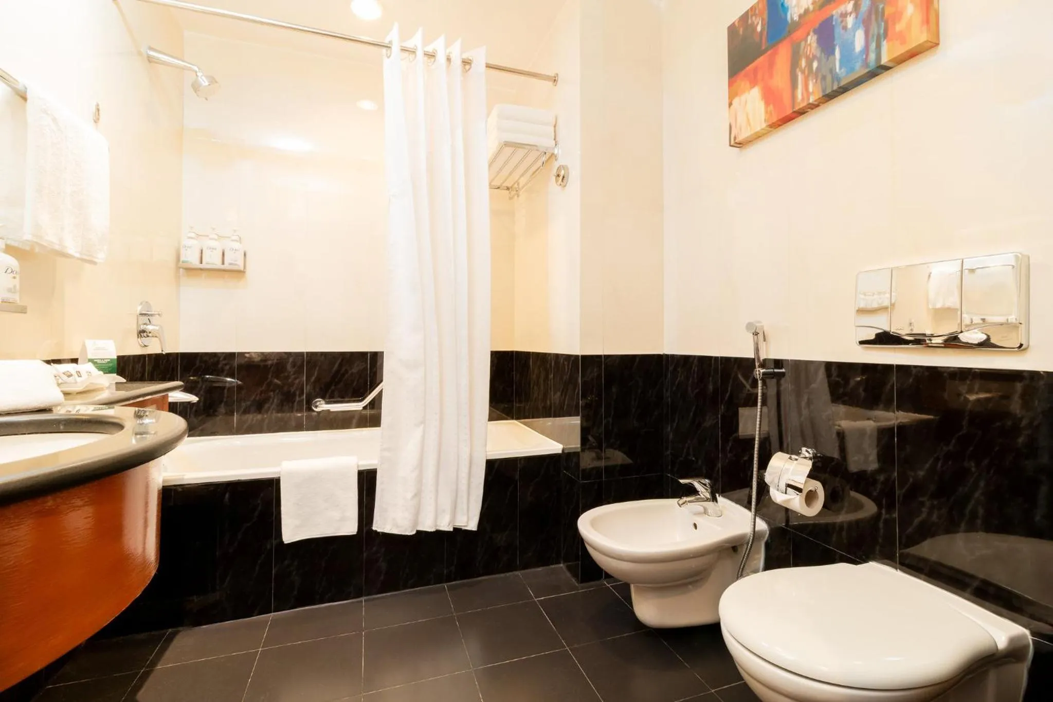 Bathroom in Holiday Inn - Suites Kuwait Salmiya by IHG
