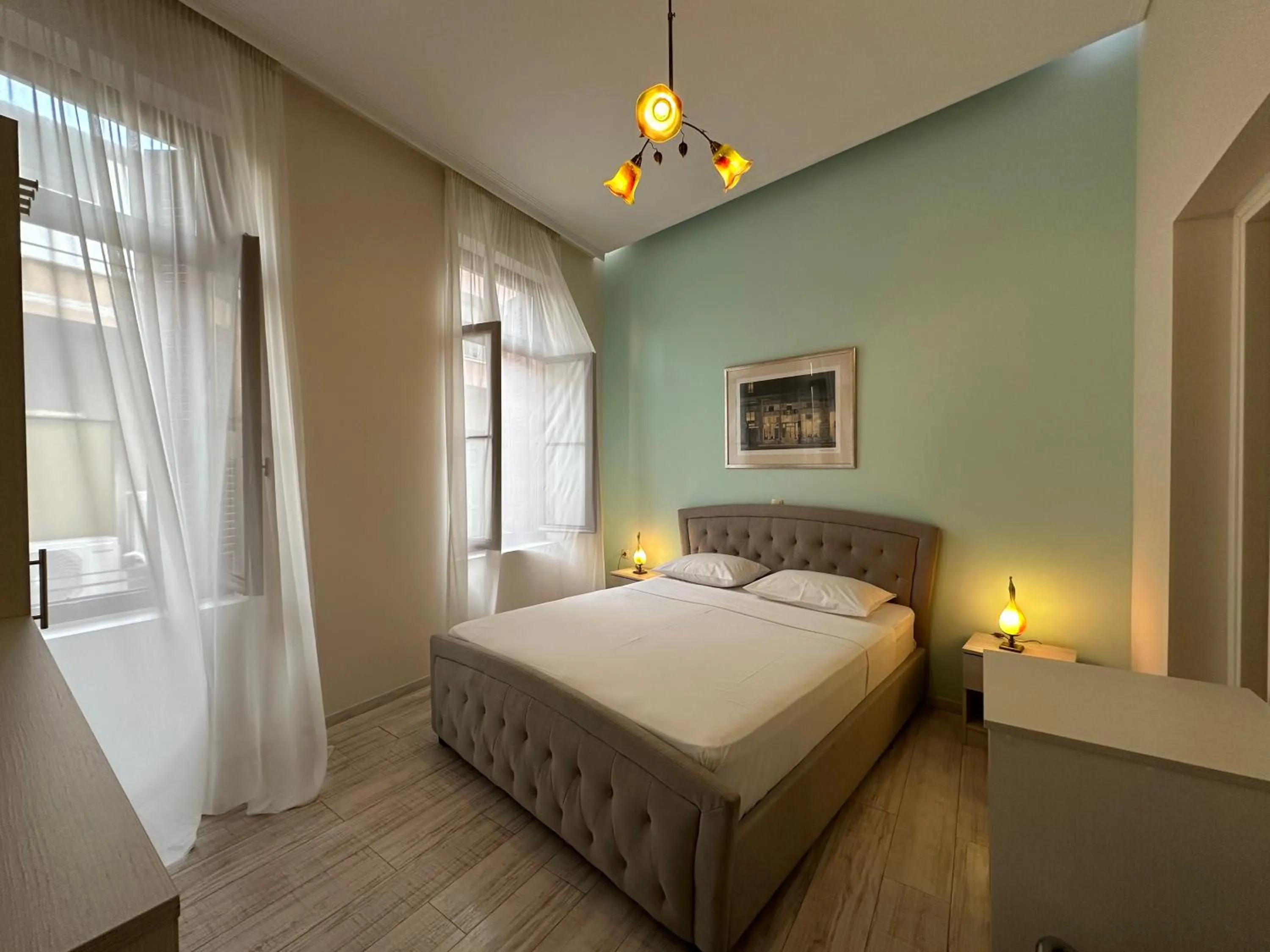 Photo of the whole room, Bed in Theasis Athens