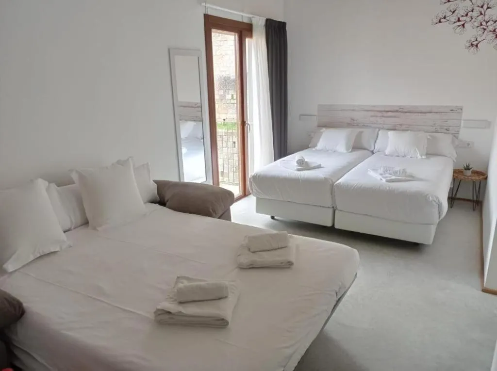 Bed in IRAIPE Estella Rooms Auto Check-in