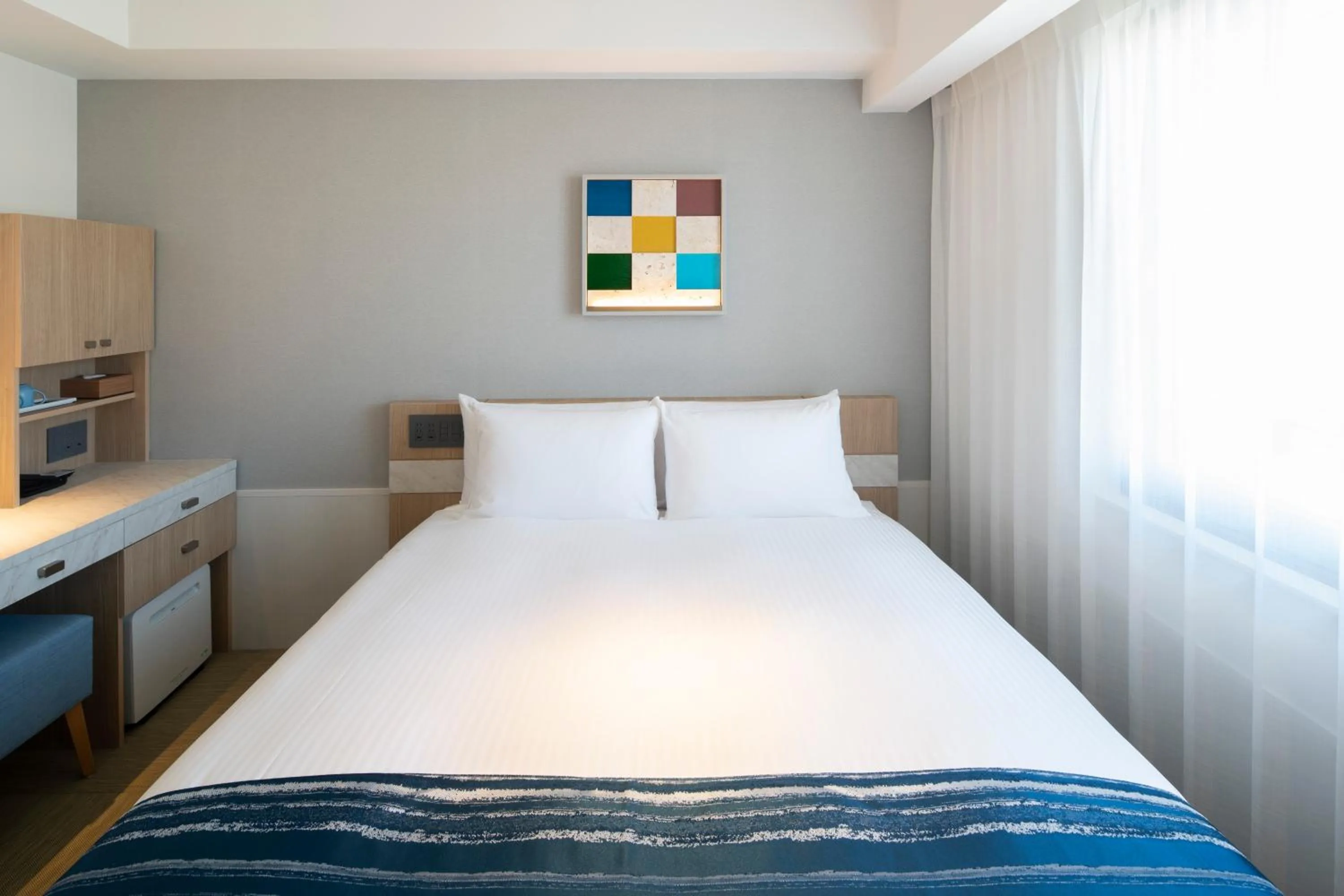 Bedroom, Bed in Okinawa Hinode Resort and Hot Spring Hotel