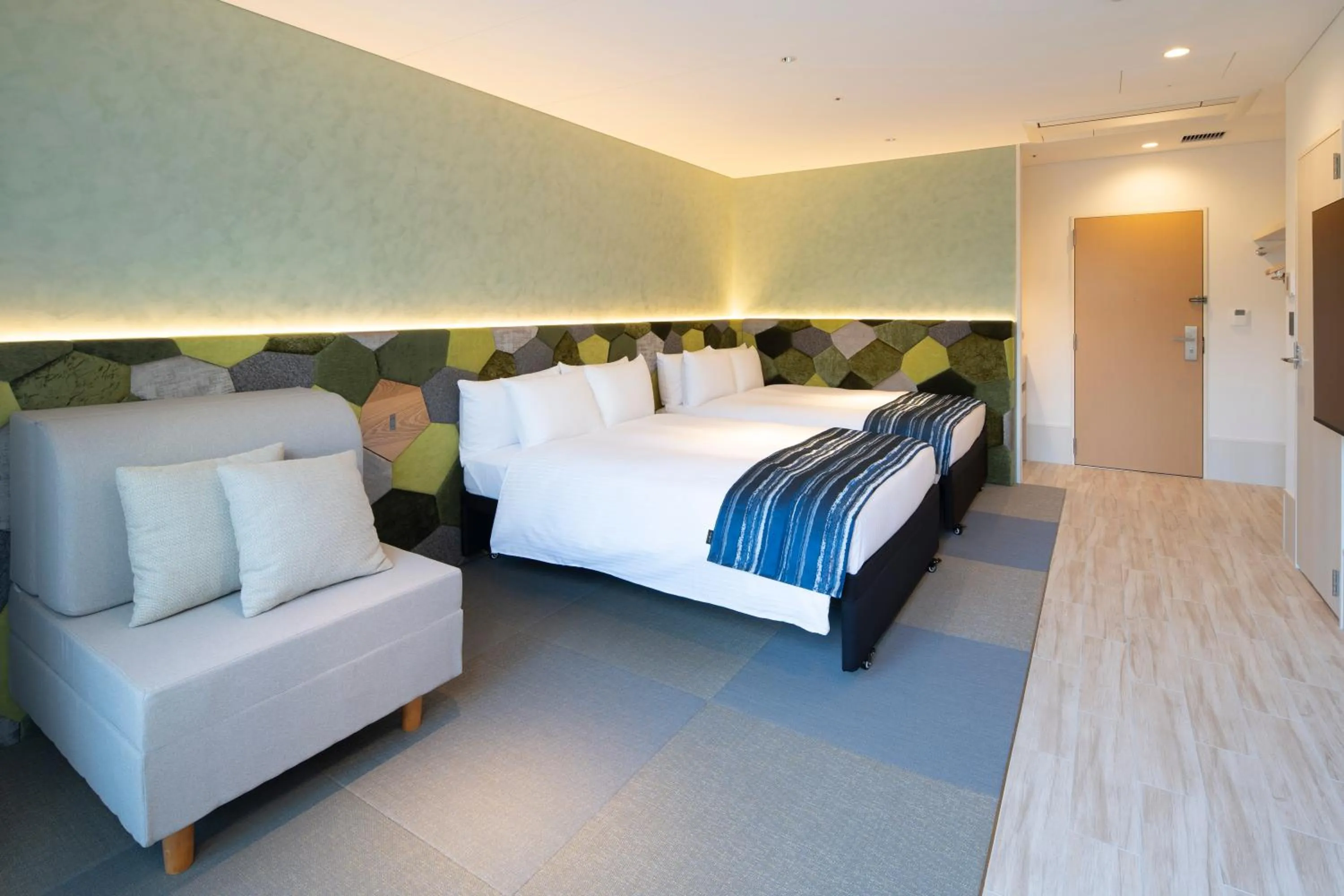 Bed in Okinawa Hinode Resort and Hot Spring Hotel