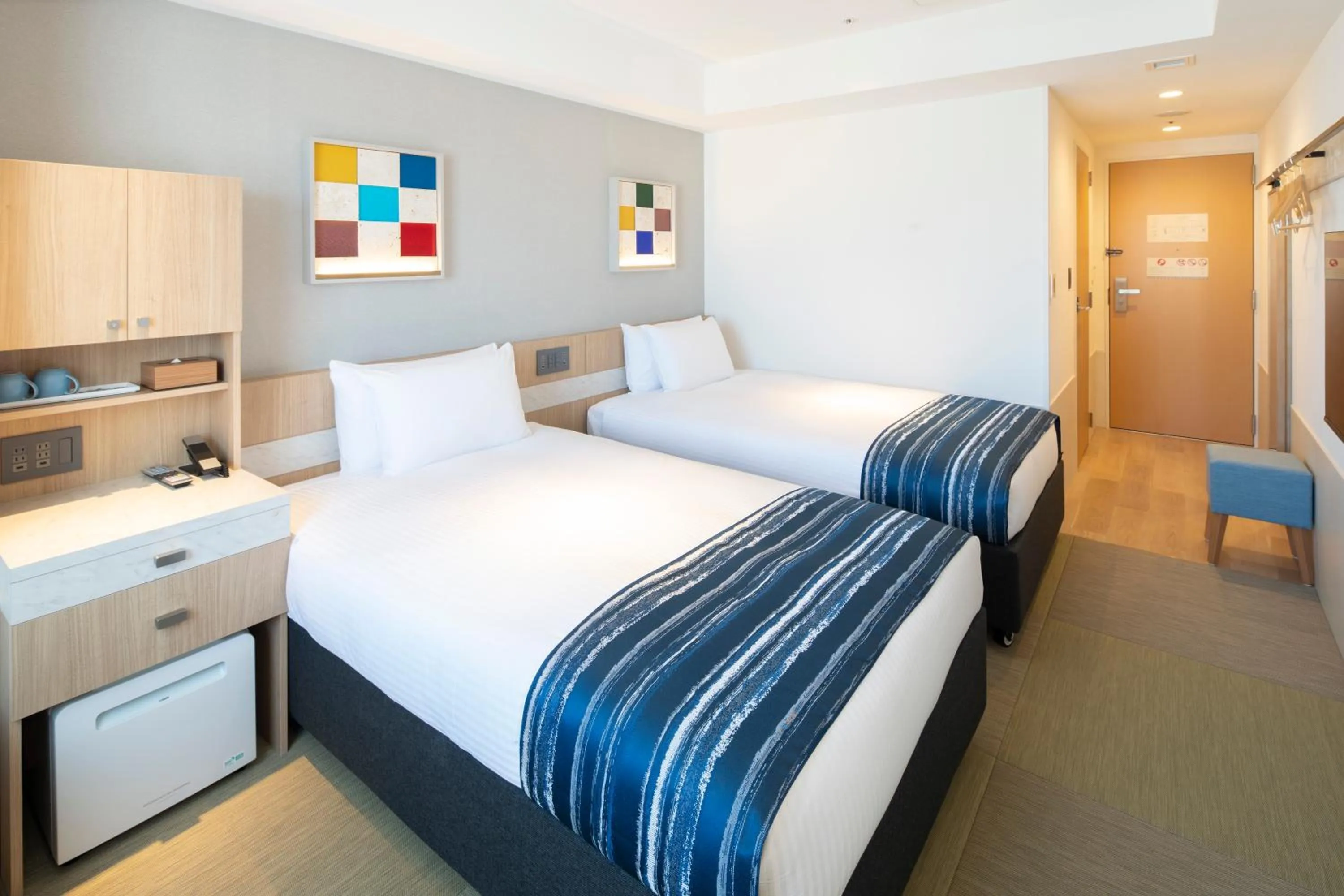 Photo of the whole room, Bed in Okinawa Hinode Resort and Hot Spring Hotel