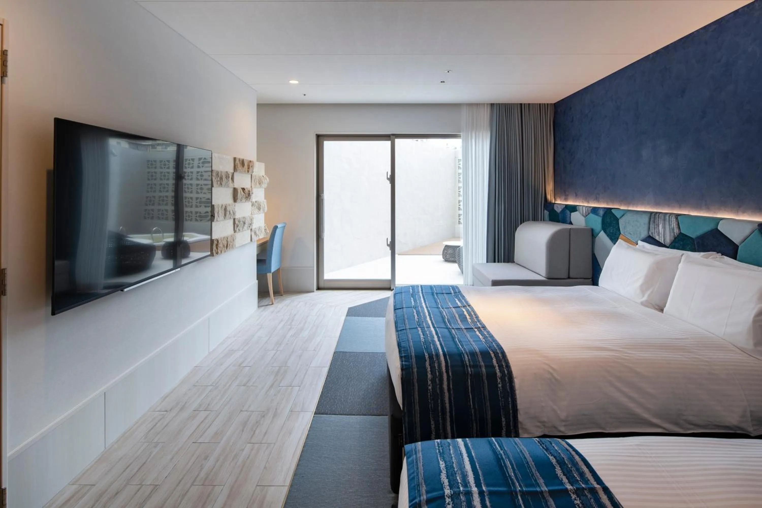 Photo of the whole room, Bed in Okinawa Hinode Resort and Hot Spring Hotel