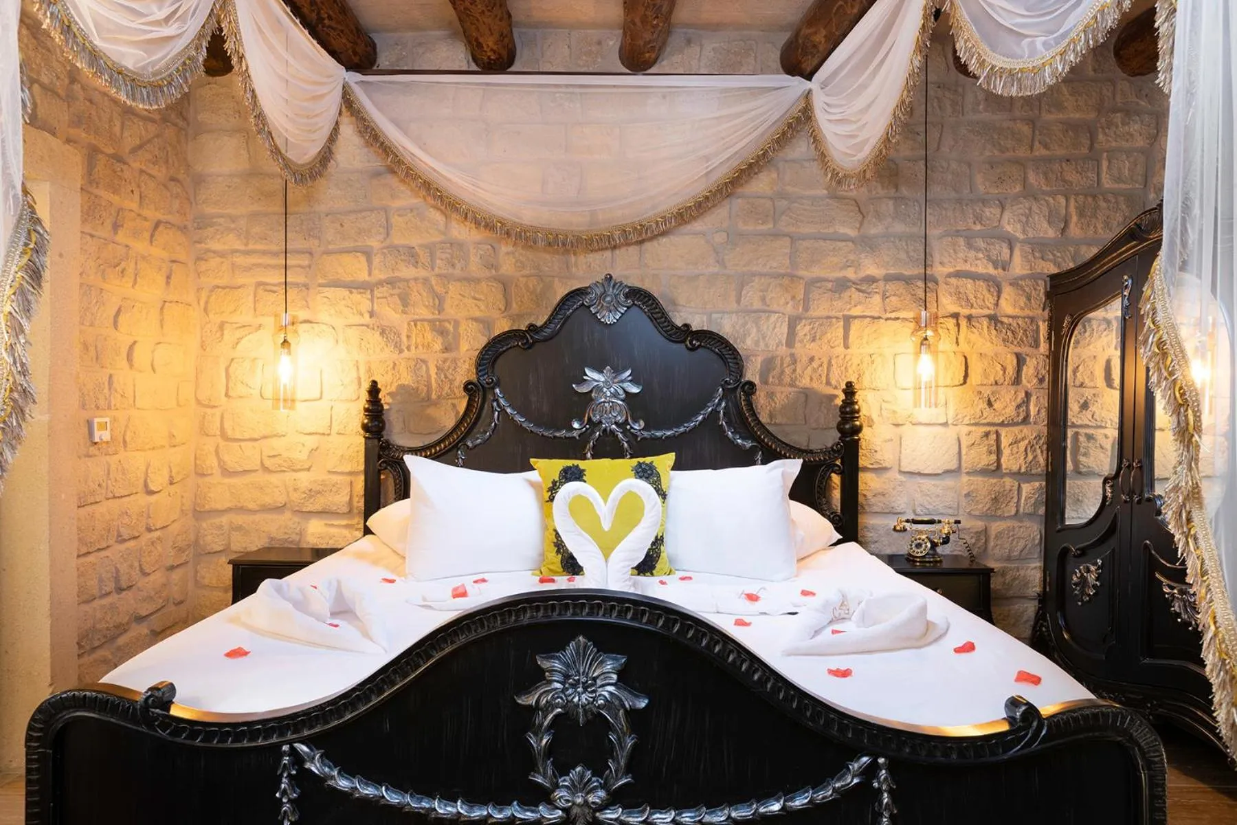 Bed in Elysion Cave Suites