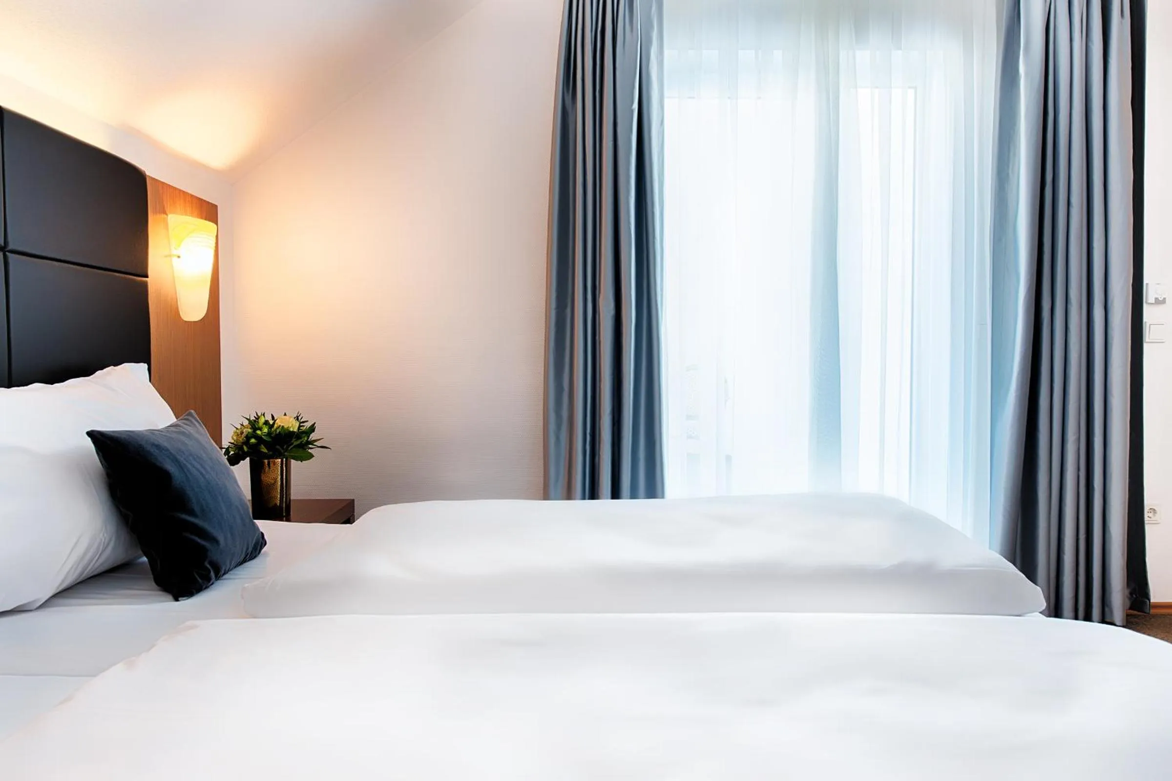 Bed in ACHAT Hotel Bad Dürkheim