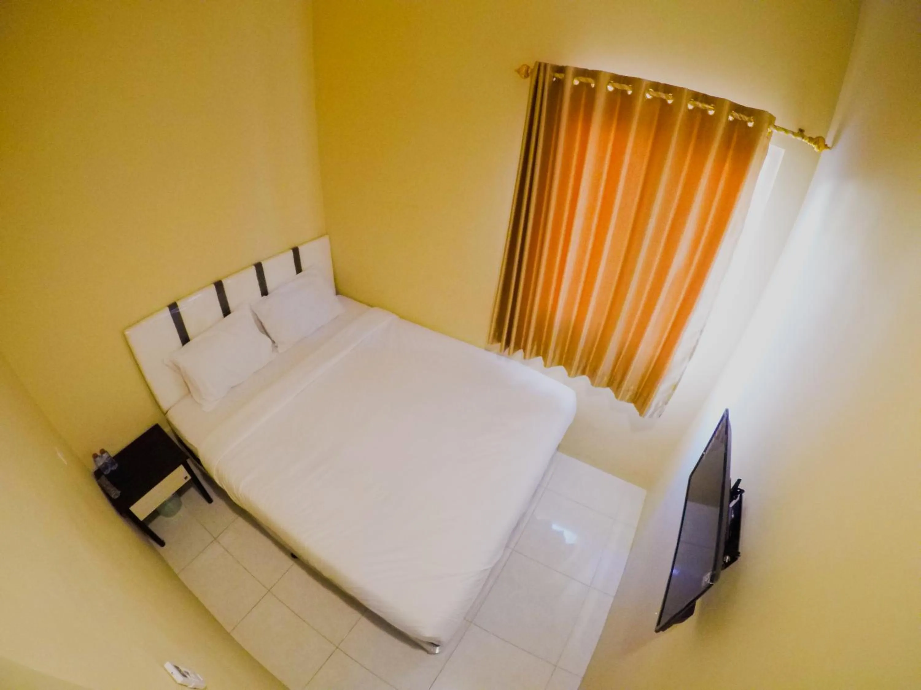 Photo of the whole room, Bed in City Residence Kutai 32