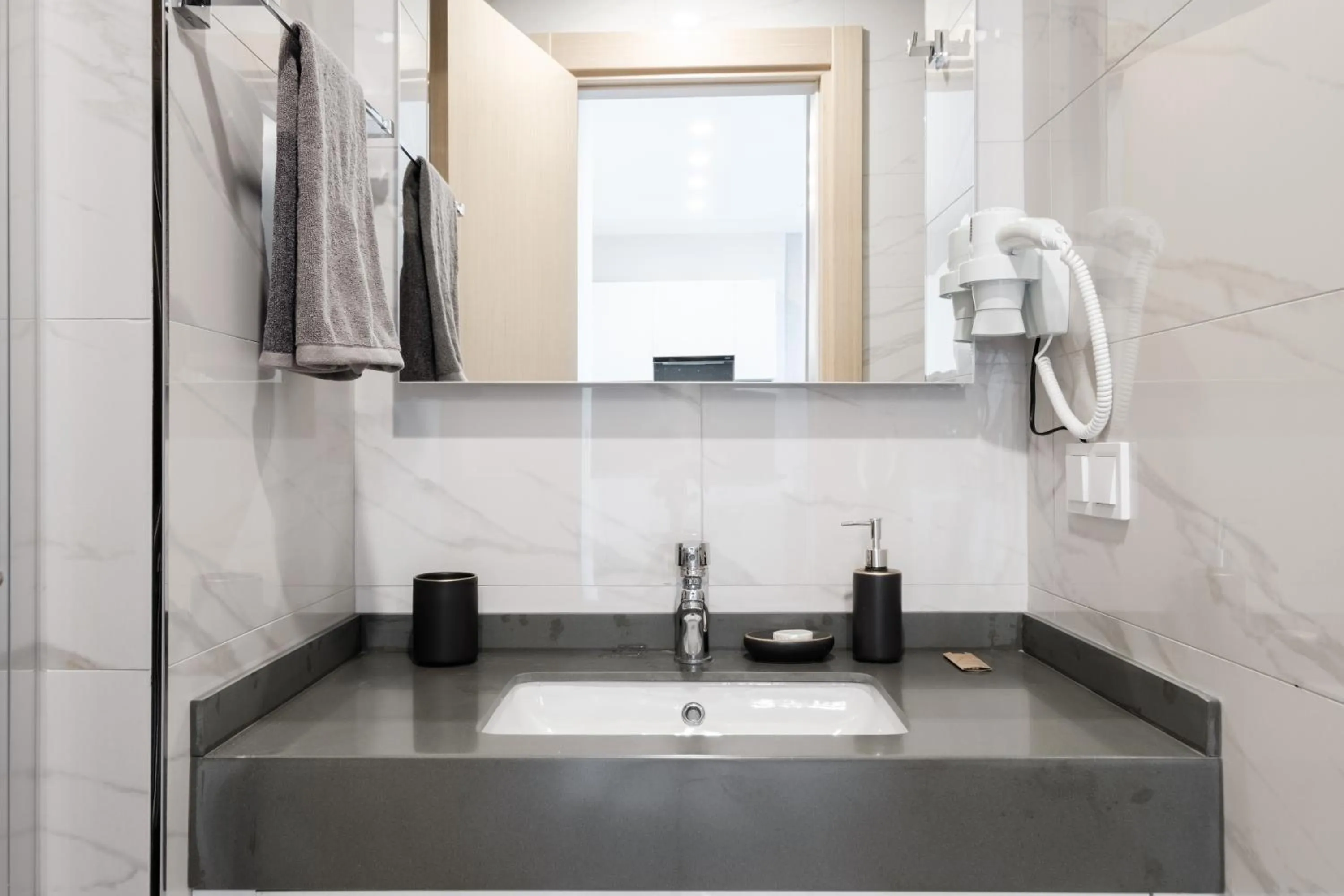 Bathroom in Grand Residence by NewInn