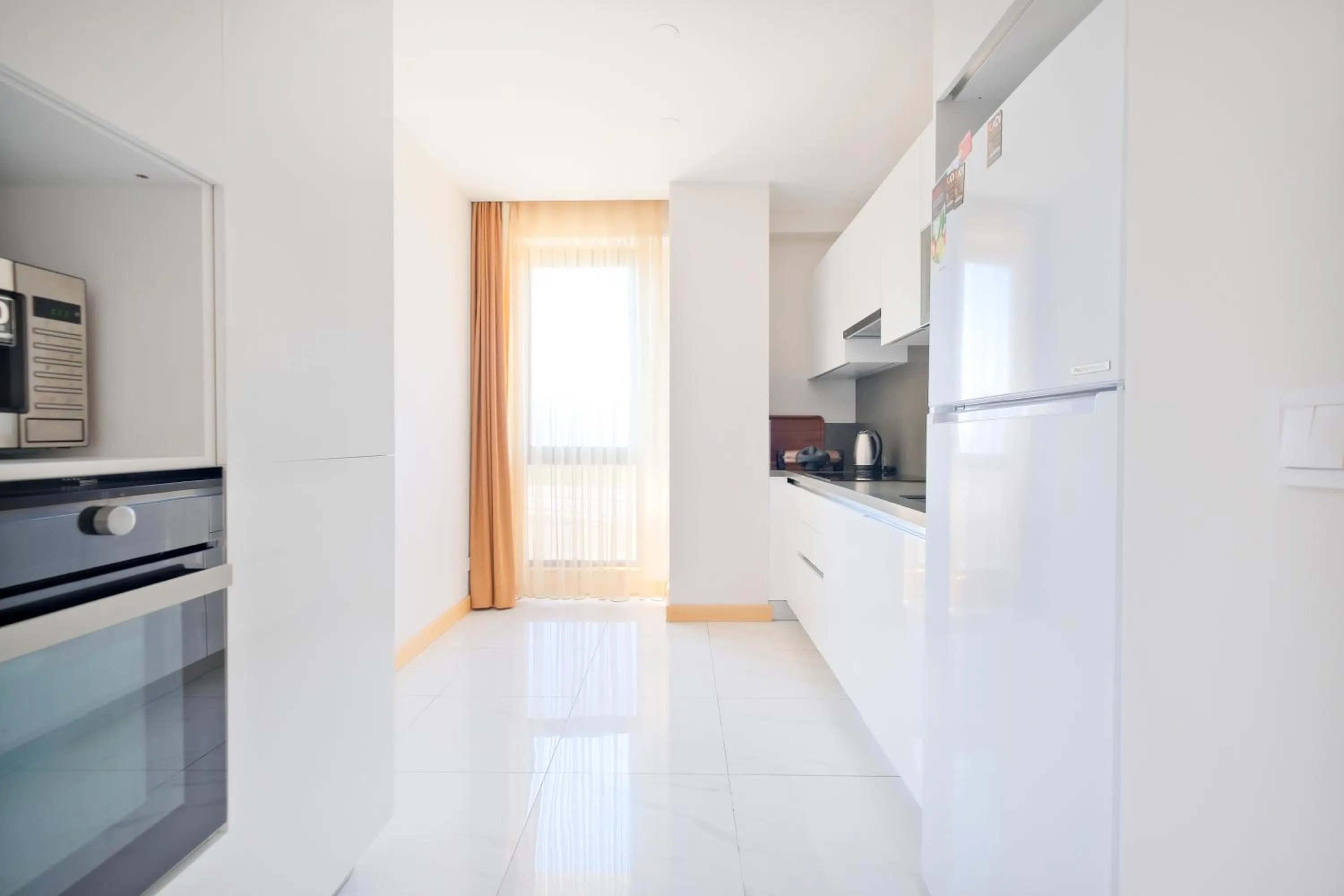 kitchen in Grand Residence by NewInn
