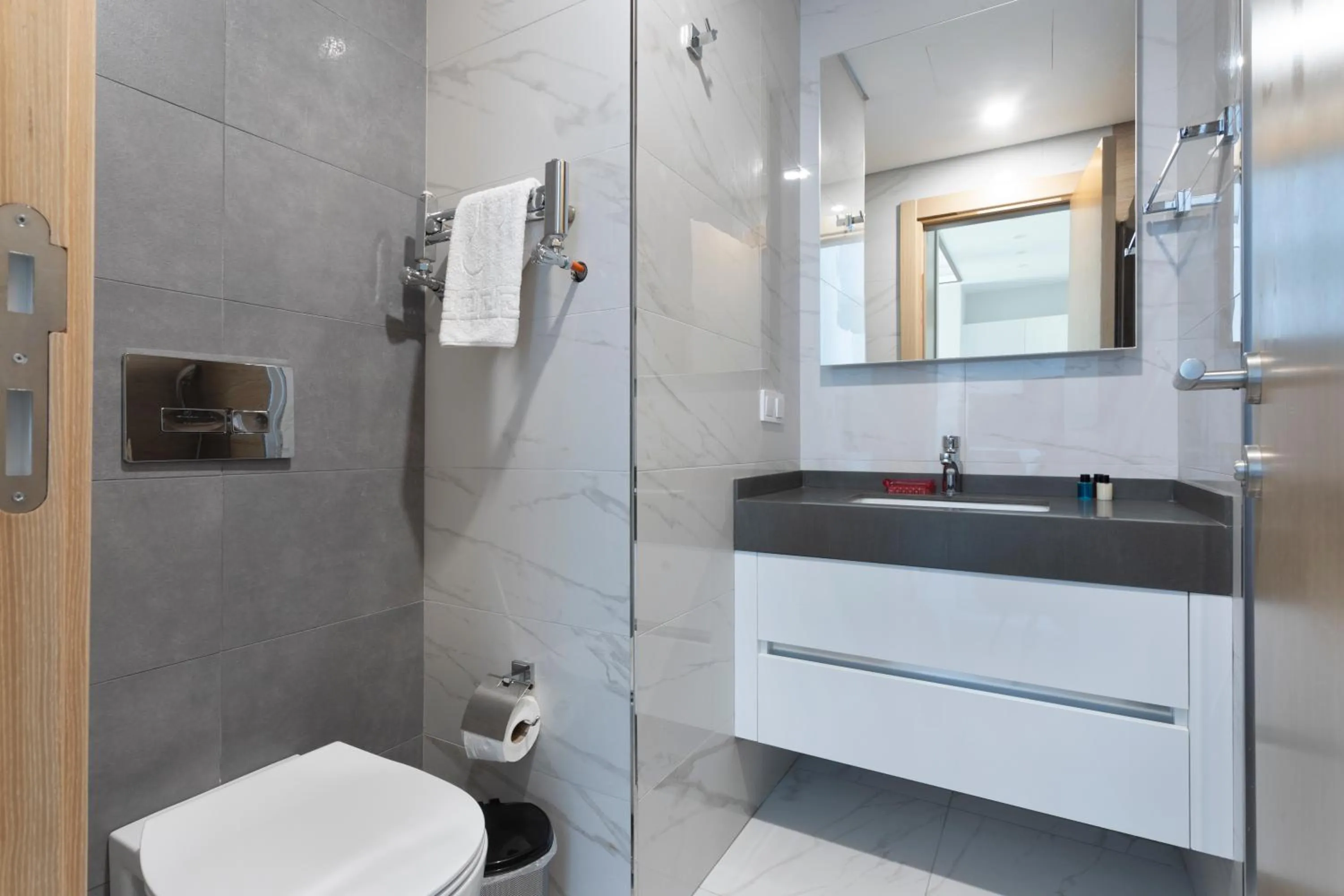 Bathroom in Grand Residence by NewInn