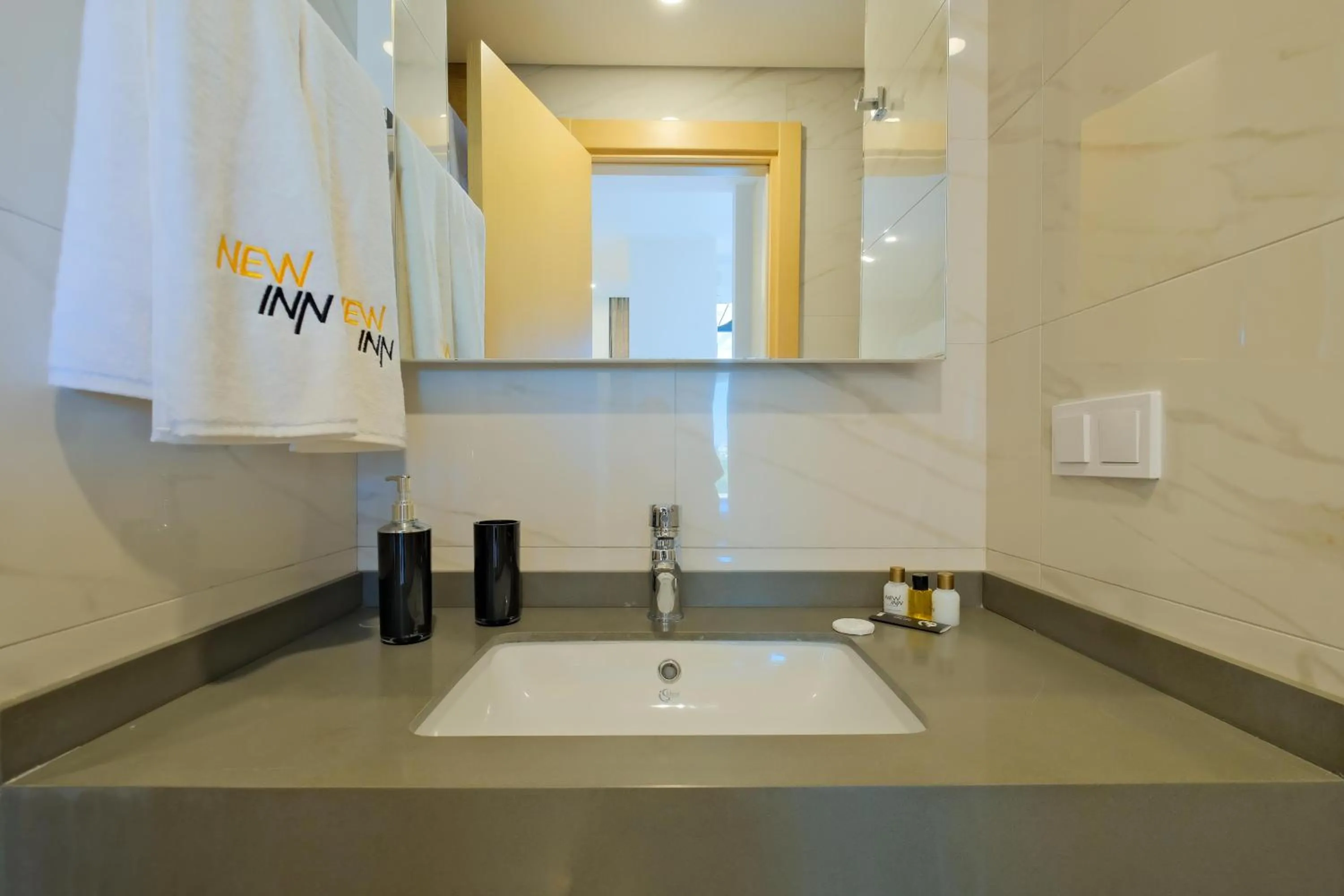 Bathroom in Grand Residence by NewInn