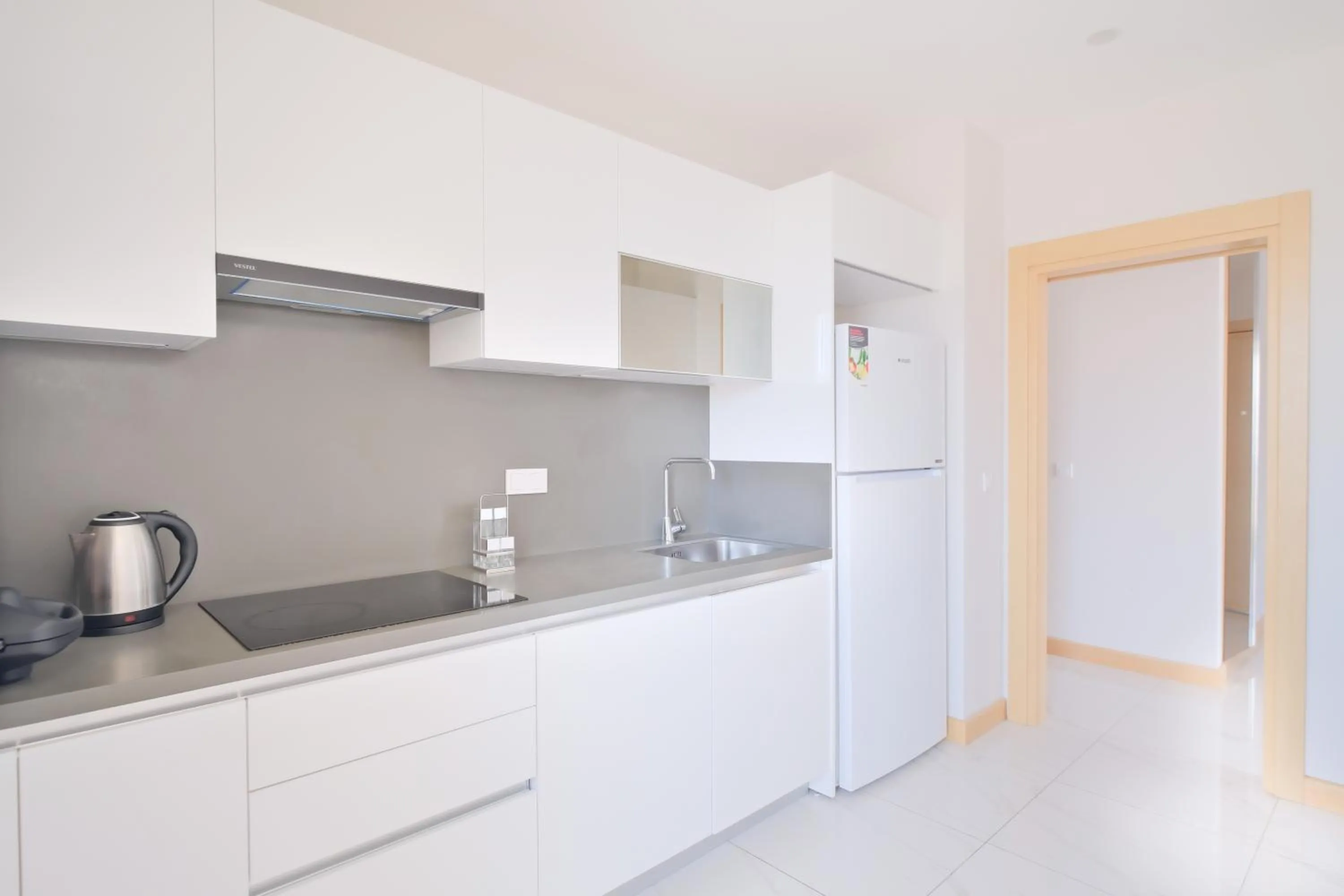 kitchen in Grand Residence by NewInn