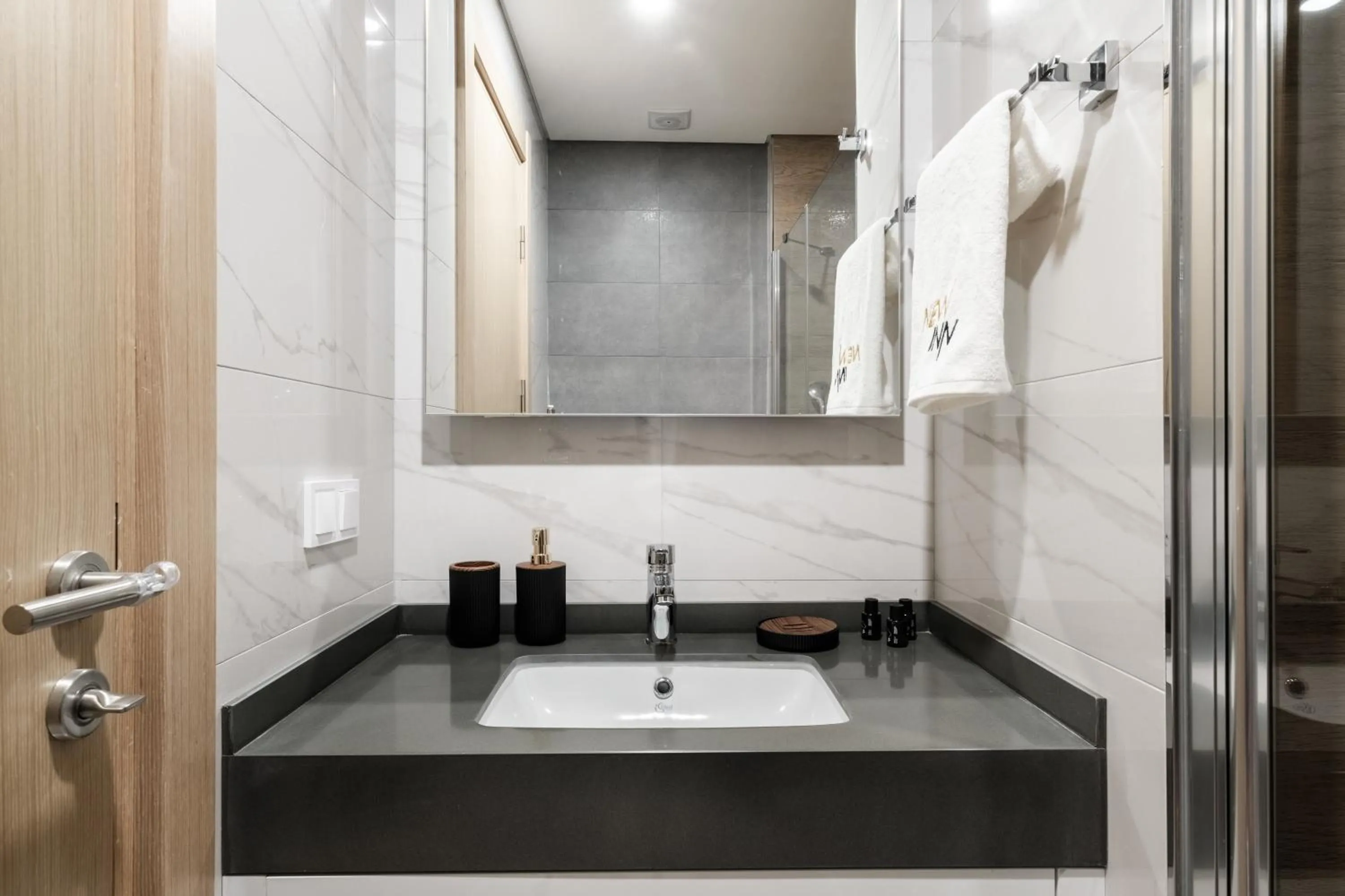 Bathroom in Grand Residence by NewInn