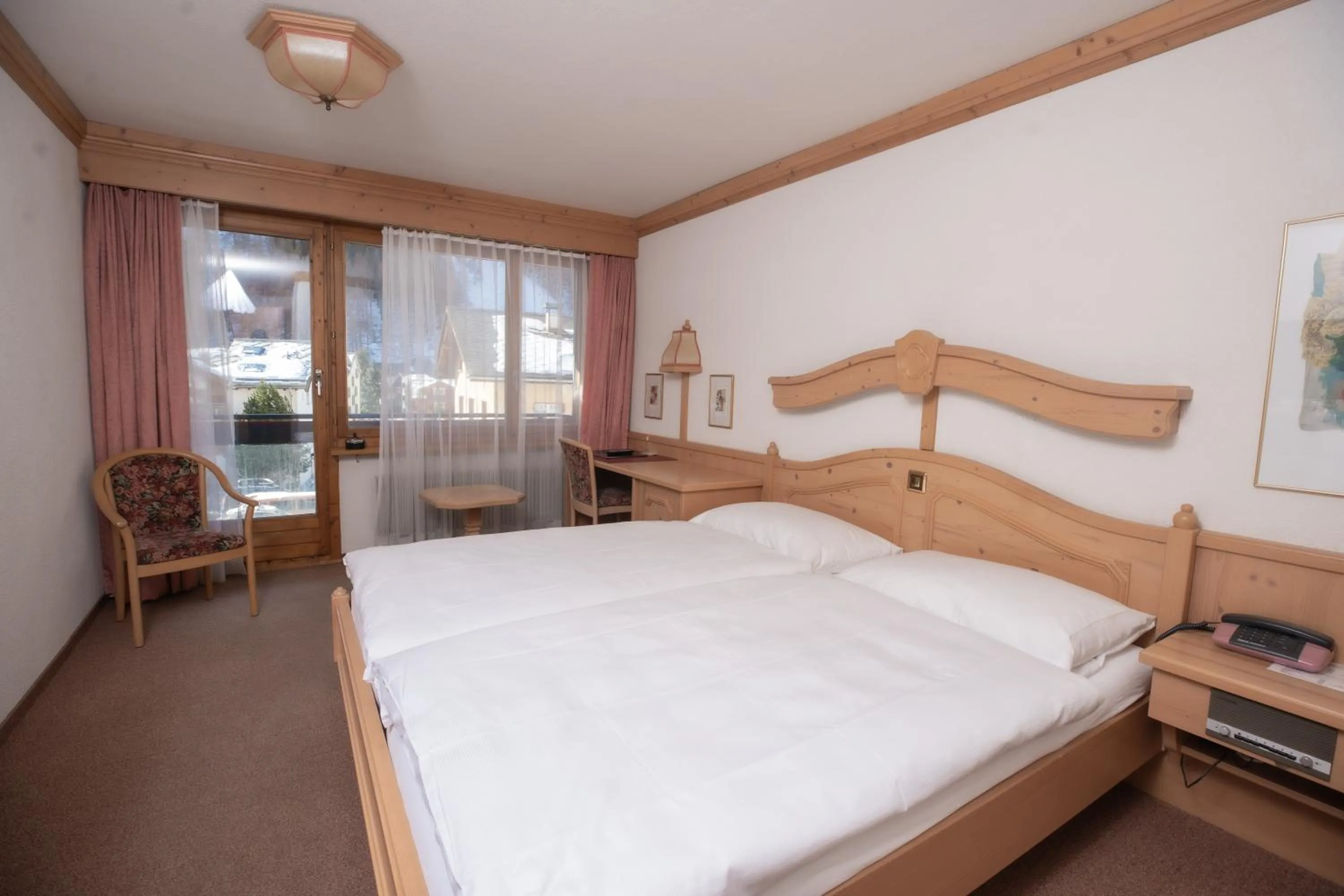 Bed in Hotel Alpenhof