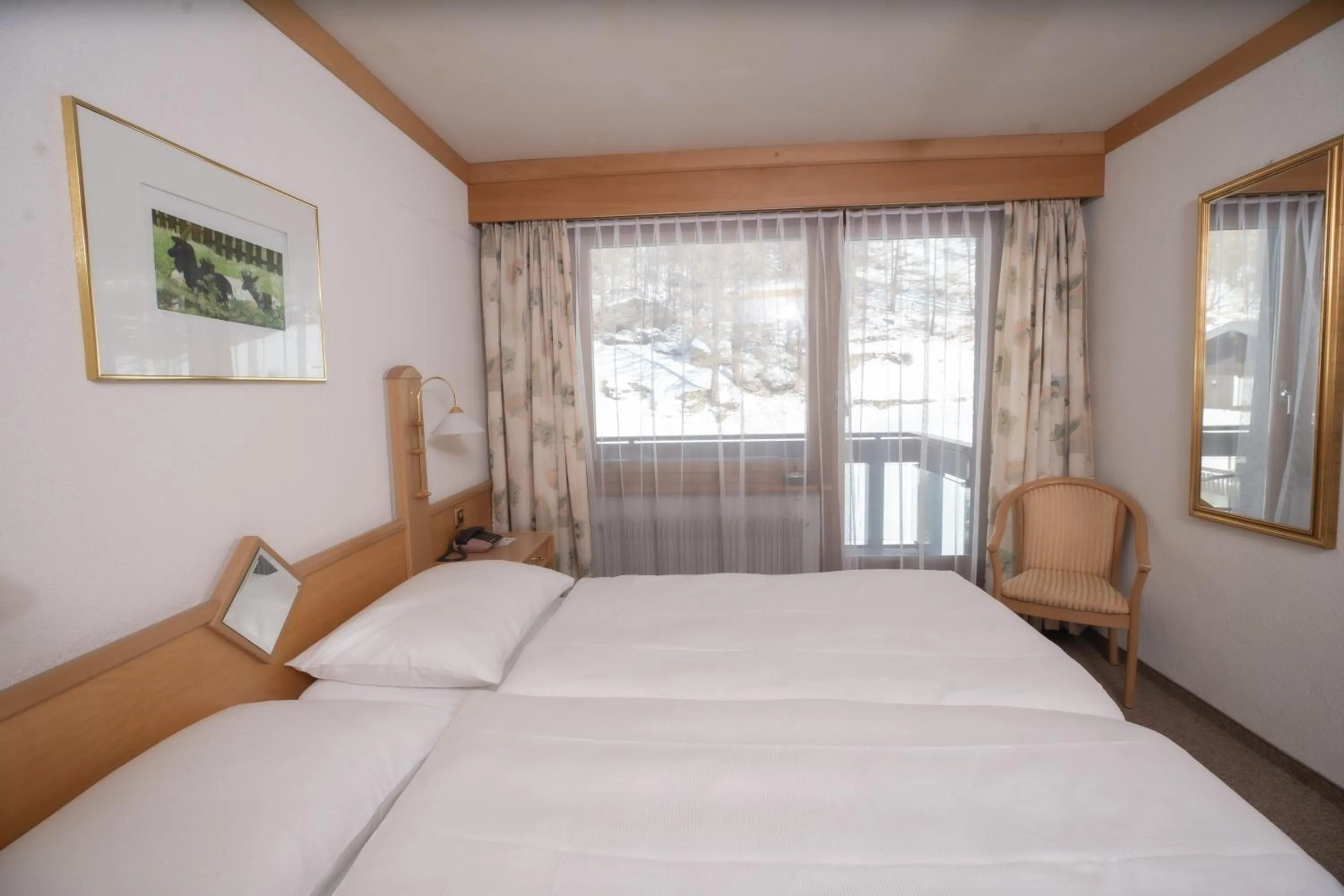 Bed in Hotel Alpenhof