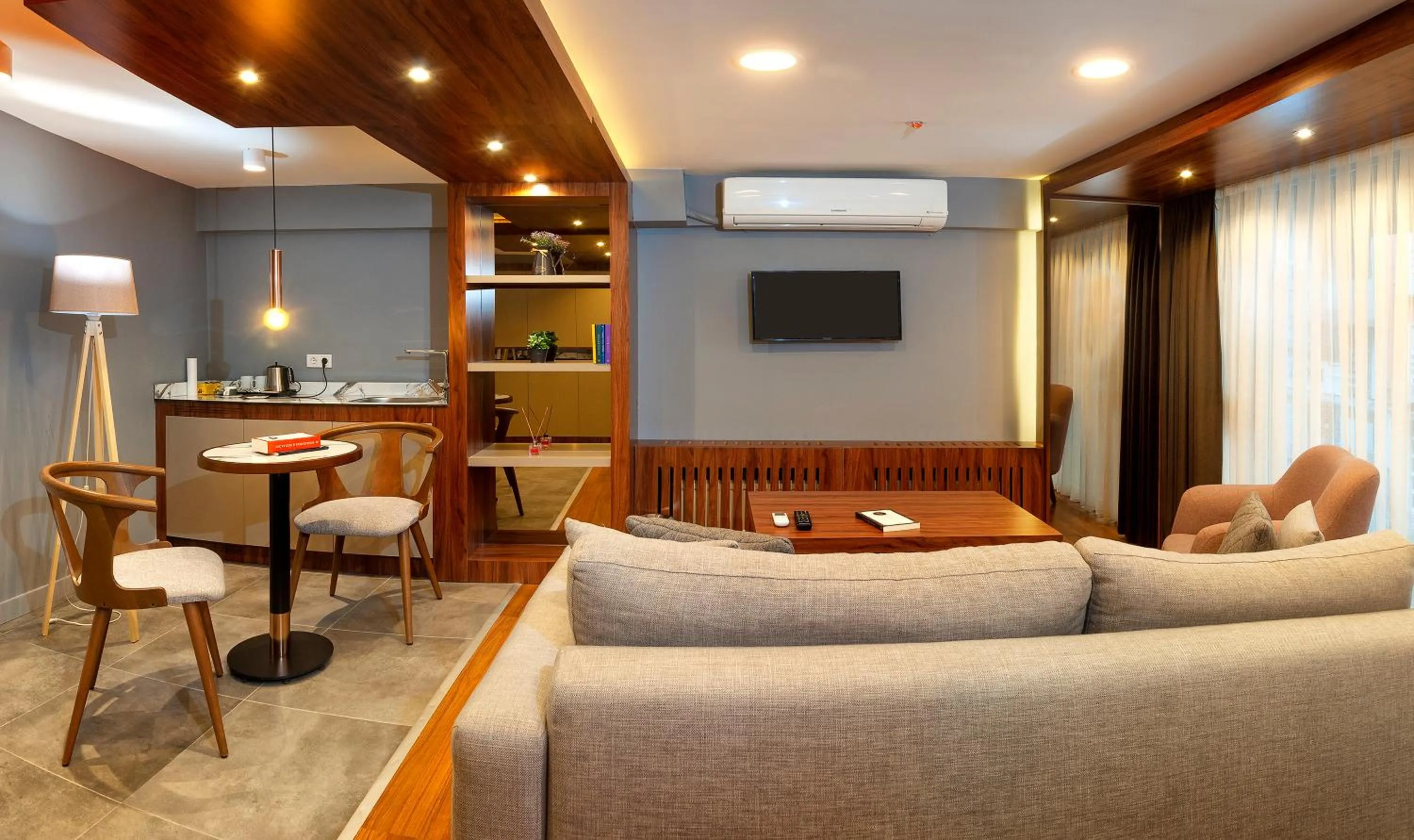 Communal lounge/ TV room in Vitabella Suites