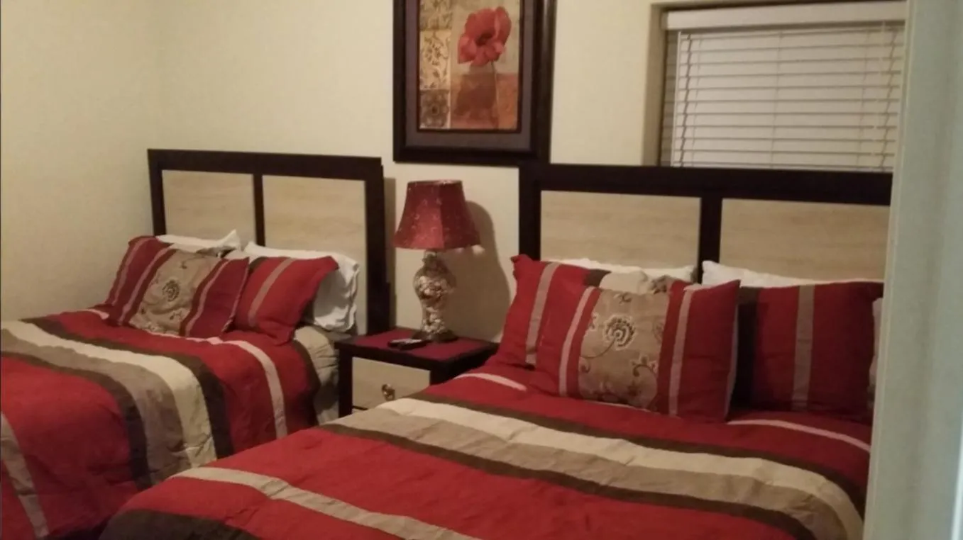 Bed in Tropic Winds Condo