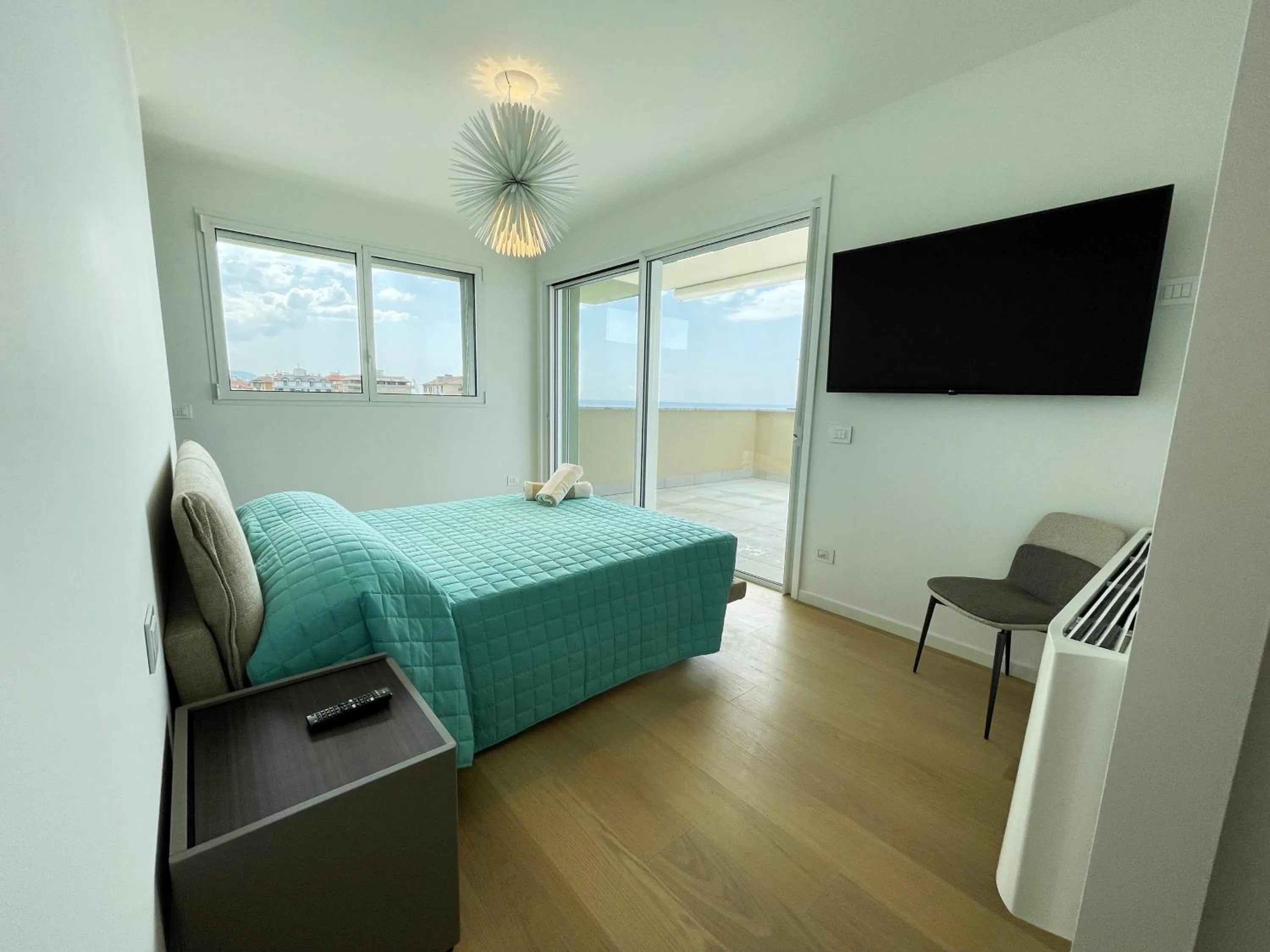 Bed in Gli Scogli Luxury Residence Hotel